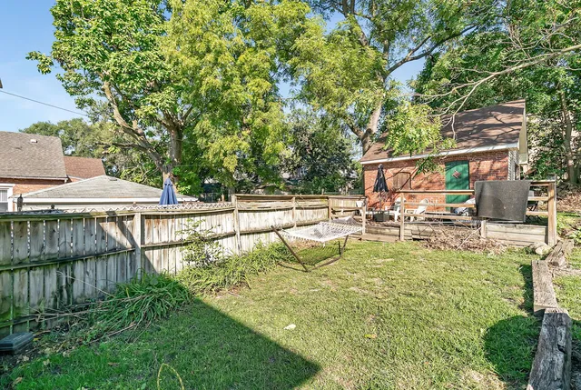 a view of a house with swimming pool and sitting area