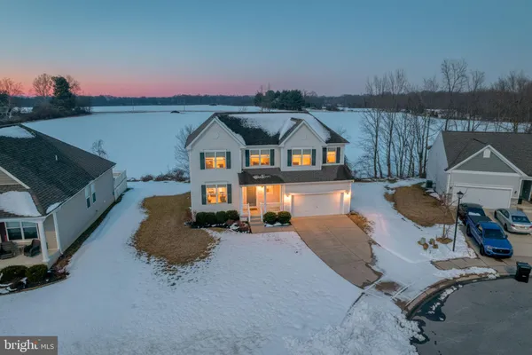 an aerial view of a house with outdoor space