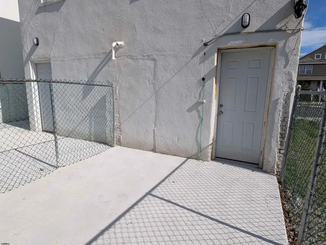 a bedroom with a bed and a mirror