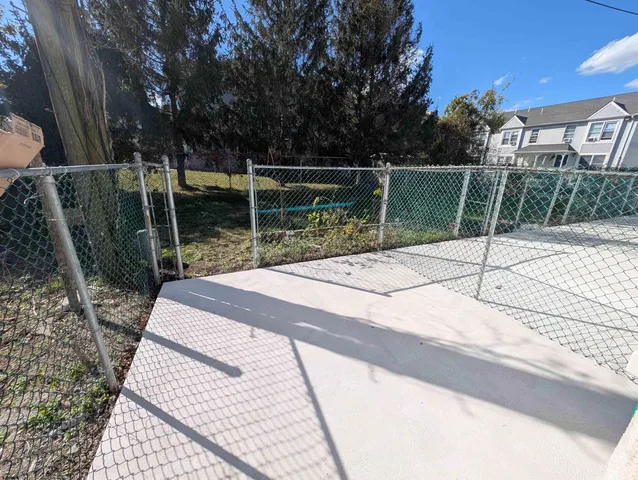 a backyard of a house with portable swimming pool and outdoor seating