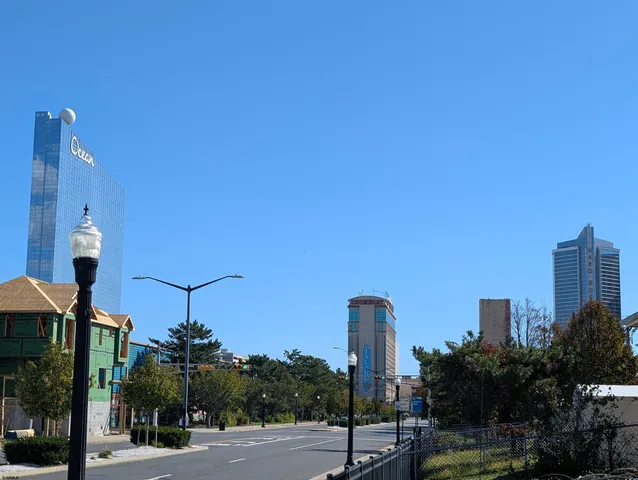 a street sign on a sidewalk next to a building