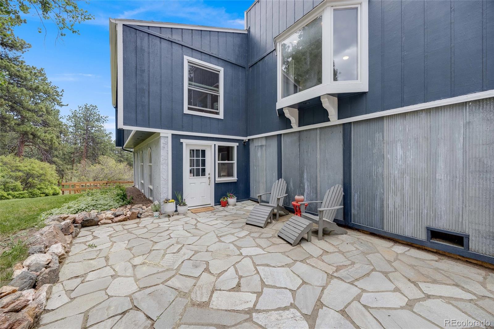 8783 Ault Lane Morrison, CO 80465 - Photo 4 of 40 a view of backyard with cabin