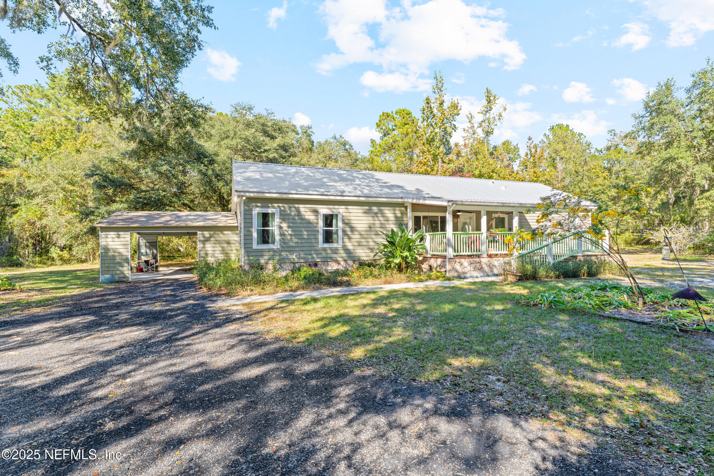 1463 Bardin Road Palatka, FL 32177 - Photo 11 of 61 a view of a house with backyard and sitting area
