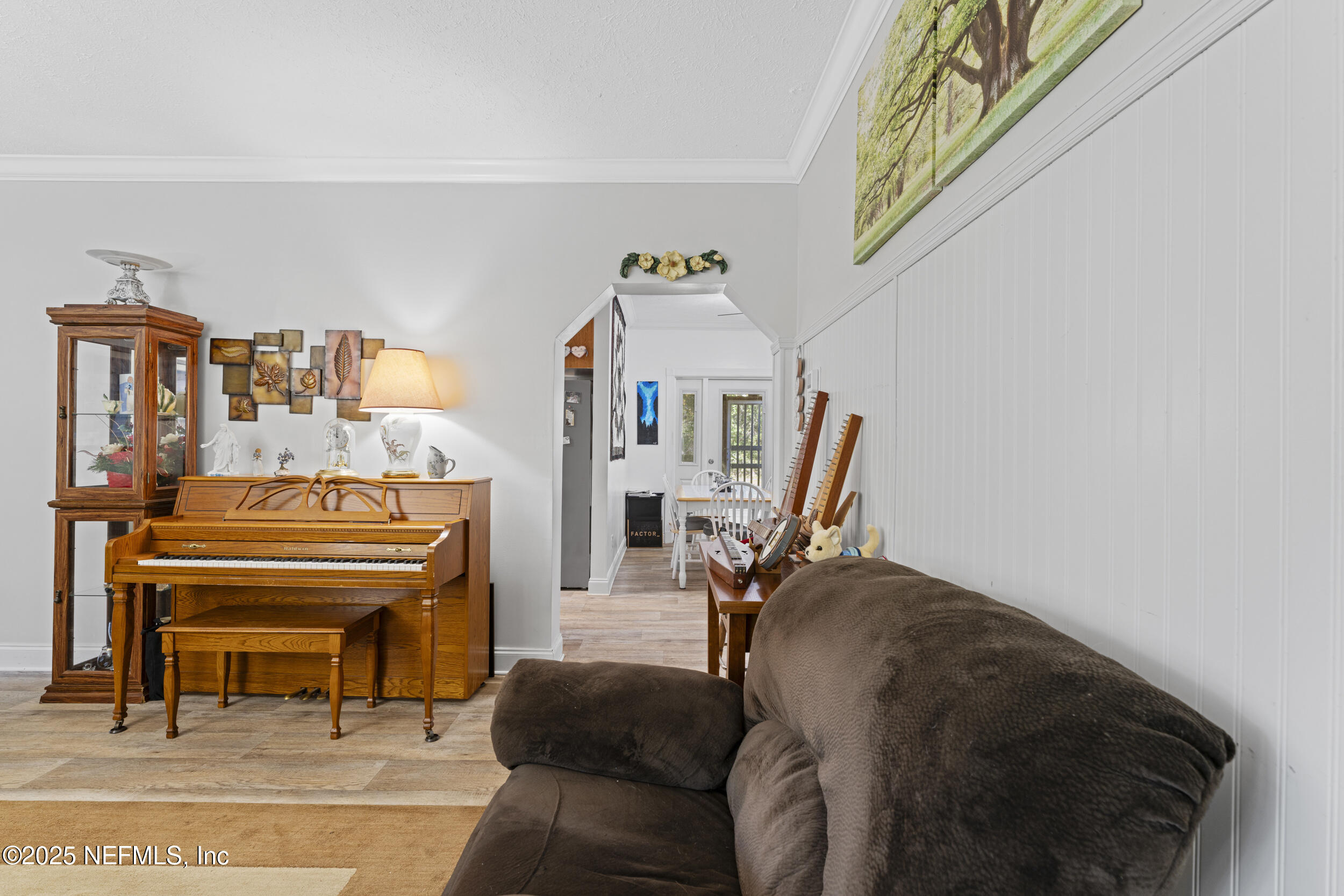 1463 Bardin Road Palatka, FL 32177 - Photo 13 of 61 a living room with furniture and a piano