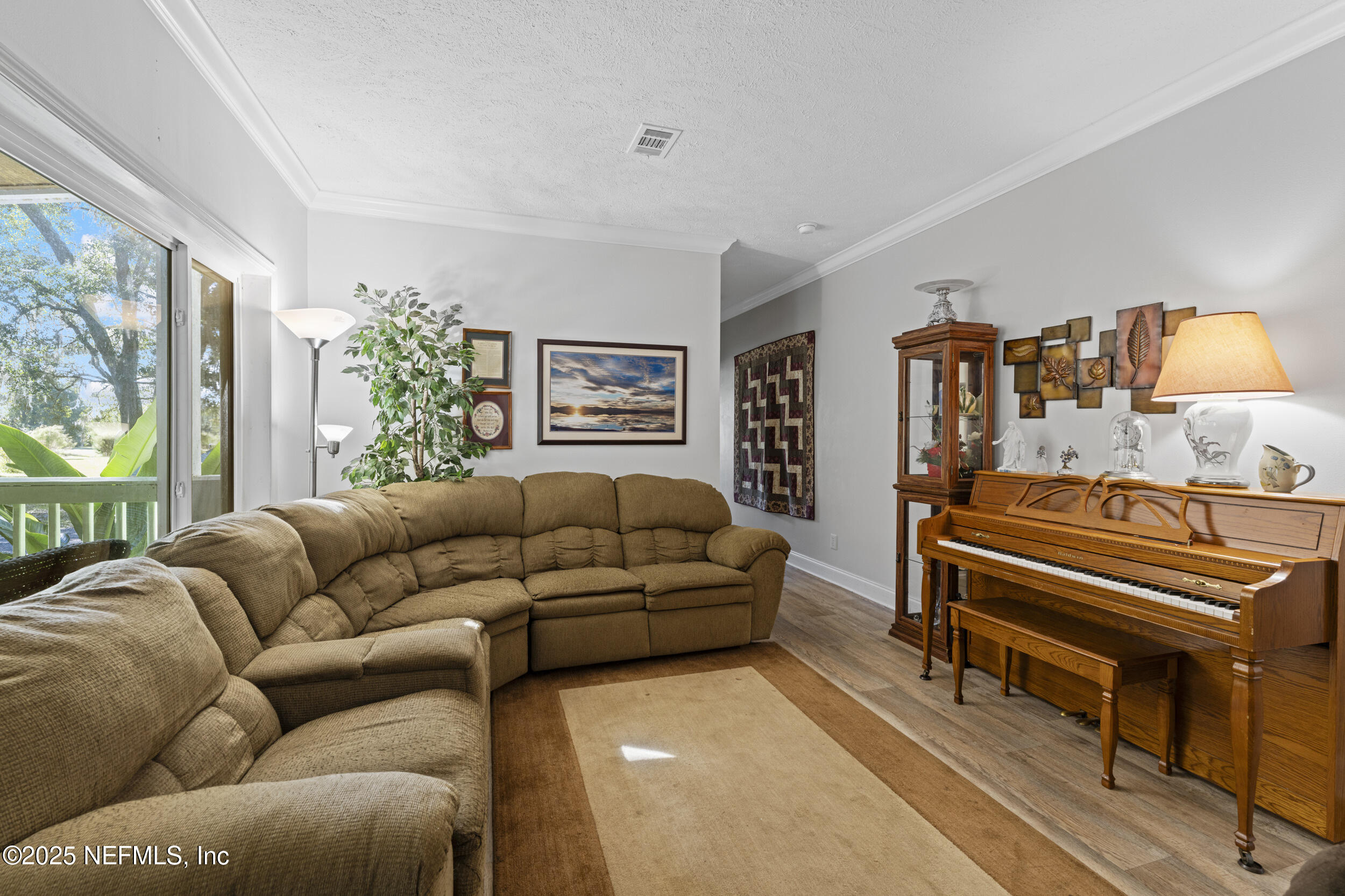 1463 Bardin Road Palatka, FL 32177 - Photo 14 of 61 a living room with furniture and a window