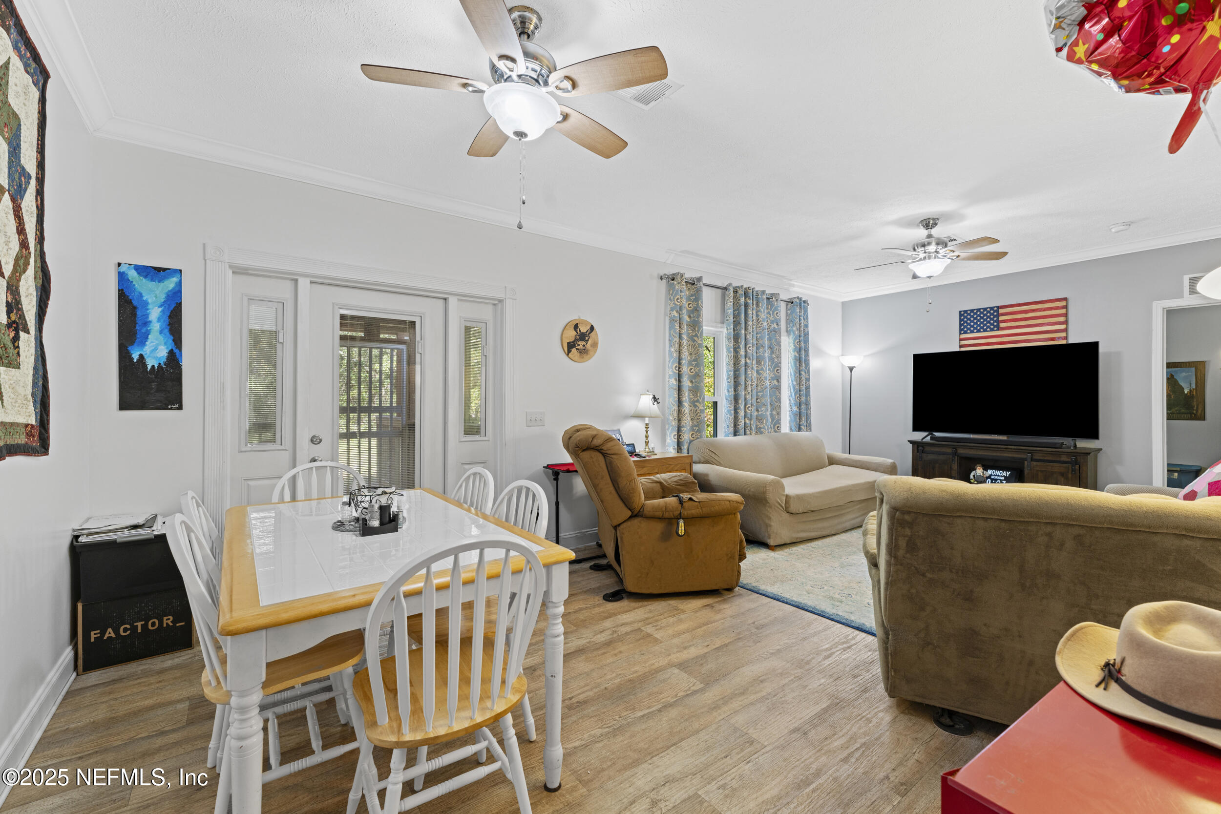 1463 Bardin Road Palatka, FL 32177 - Photo 21 of 61 a living room with furniture and a flat screen tv