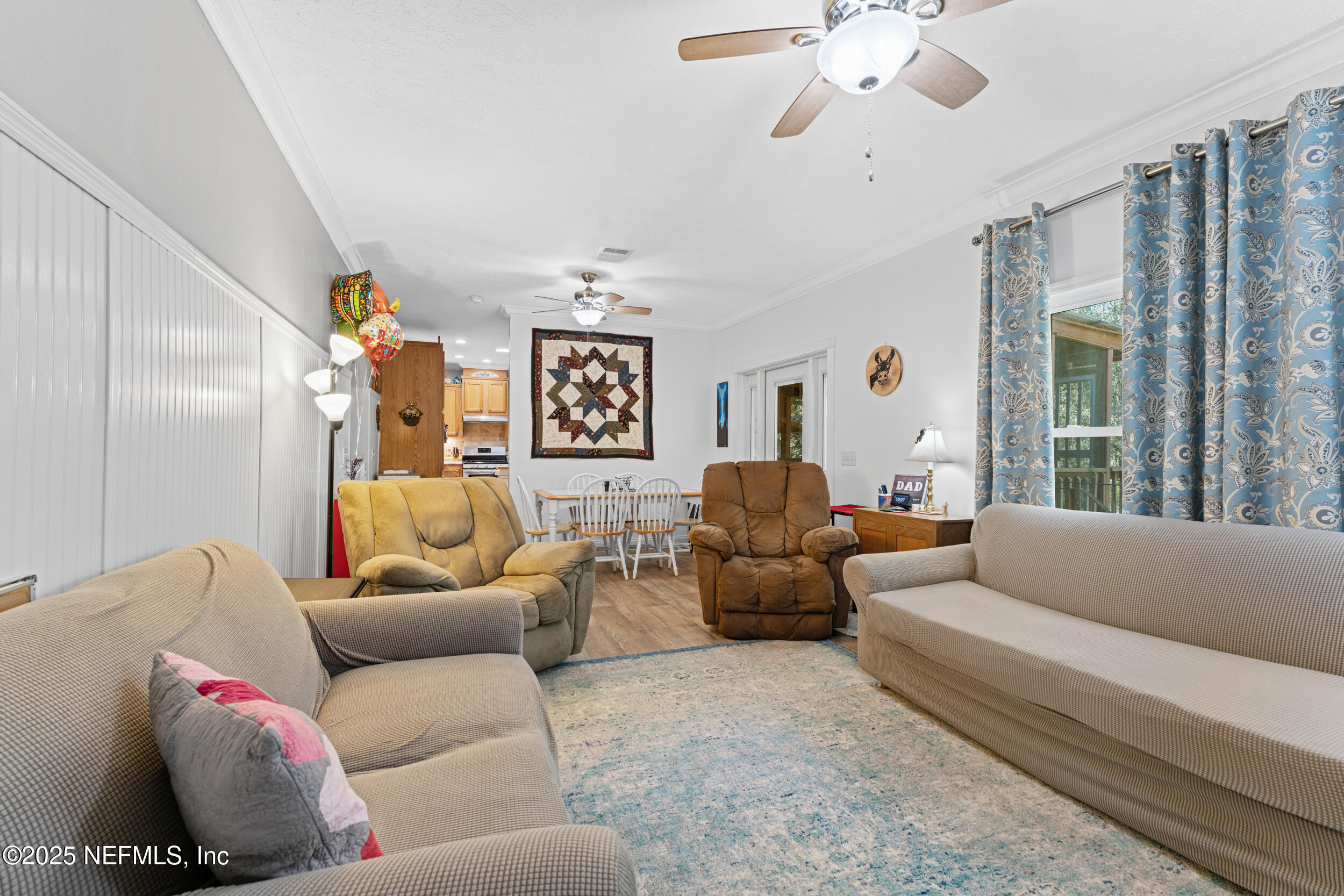 1463 Bardin Road Palatka, FL 32177 - Photo 23 of 61 a living room with furniture and a large window
