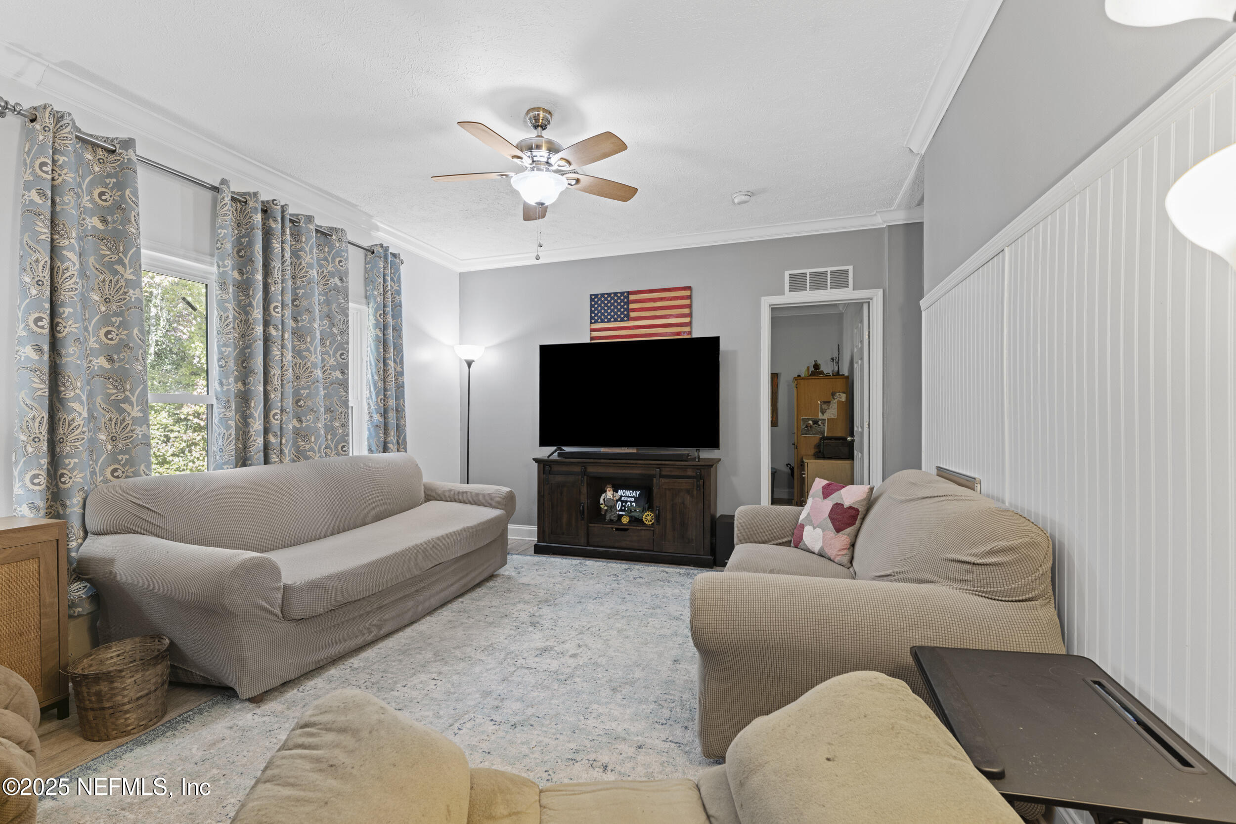 1463 Bardin Road Palatka, FL 32177 - Photo 24 of 61 a living room with furniture and a flat screen tv