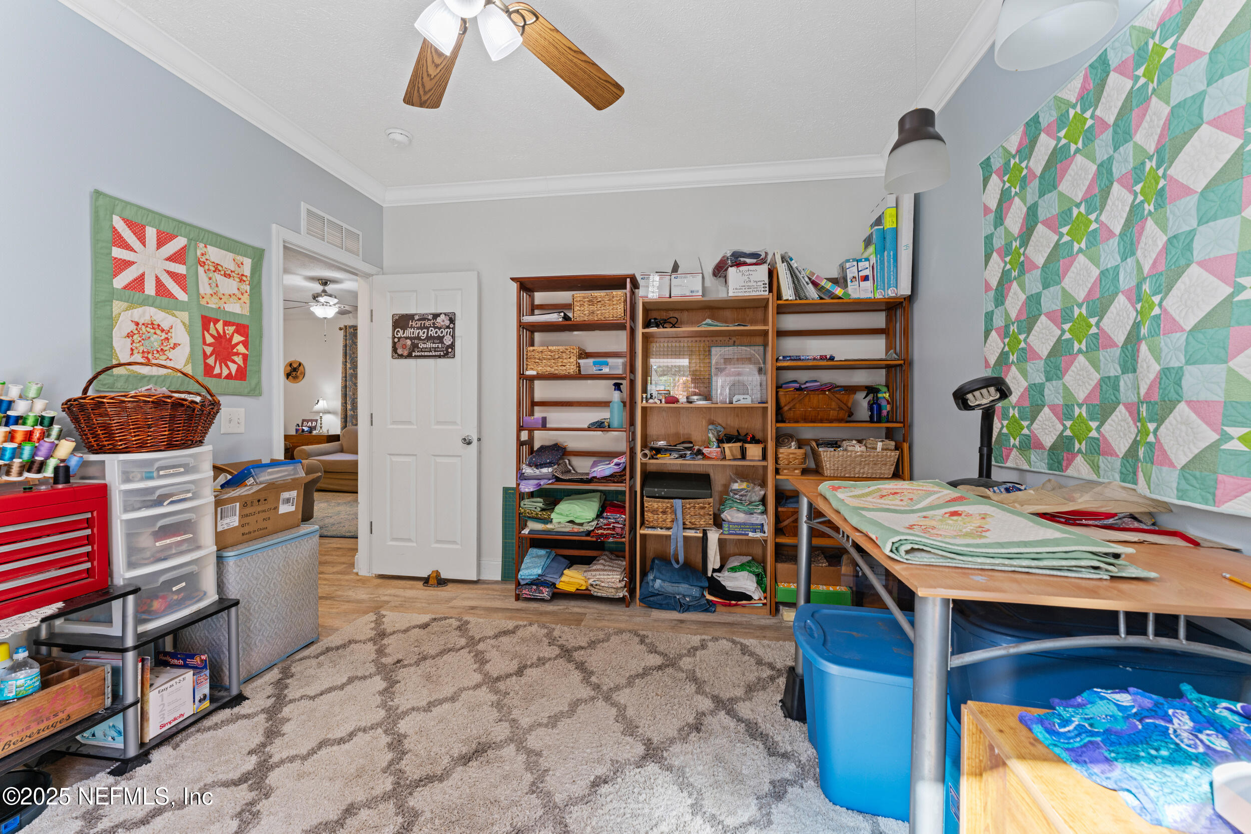 1463 Bardin Road Palatka, FL 32177 - Photo 26 of 61 a bedroom with a bed and a bookshelf