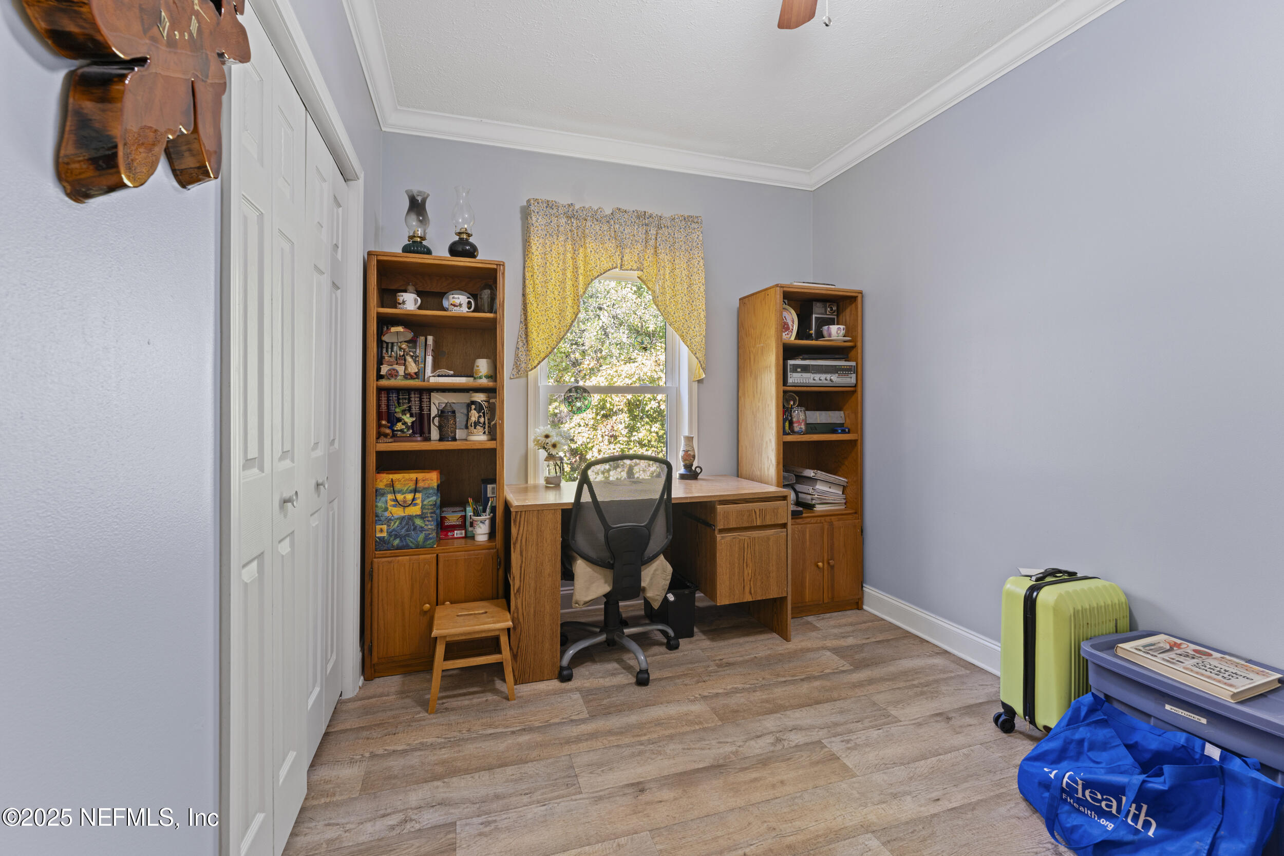 1463 Bardin Road Palatka, FL 32177 - Photo 29 of 61 a view of a workspace with furniture and a window