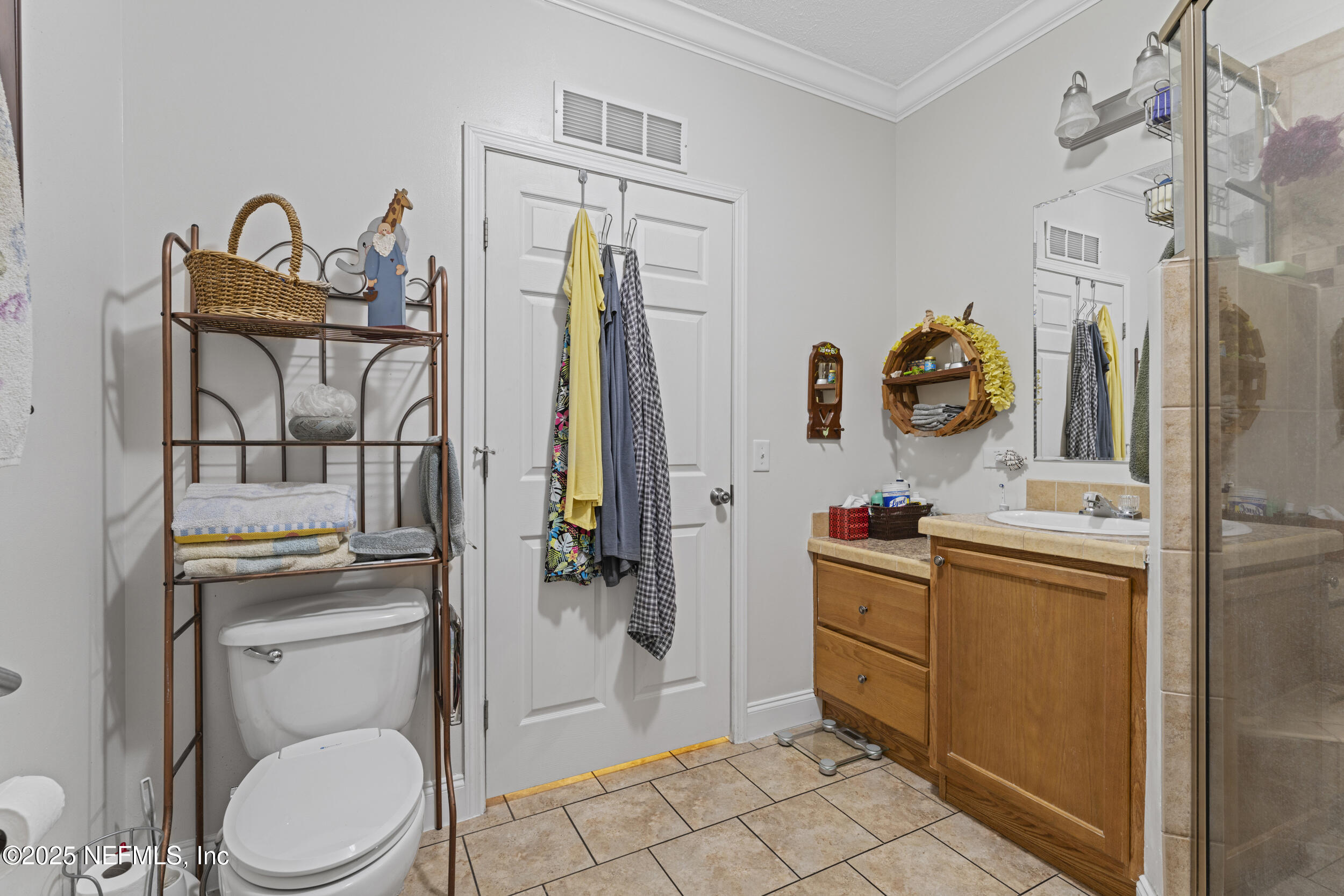 1463 Bardin Road Palatka, FL 32177 - Photo 33 of 61 a bathroom with a toilet and a shower