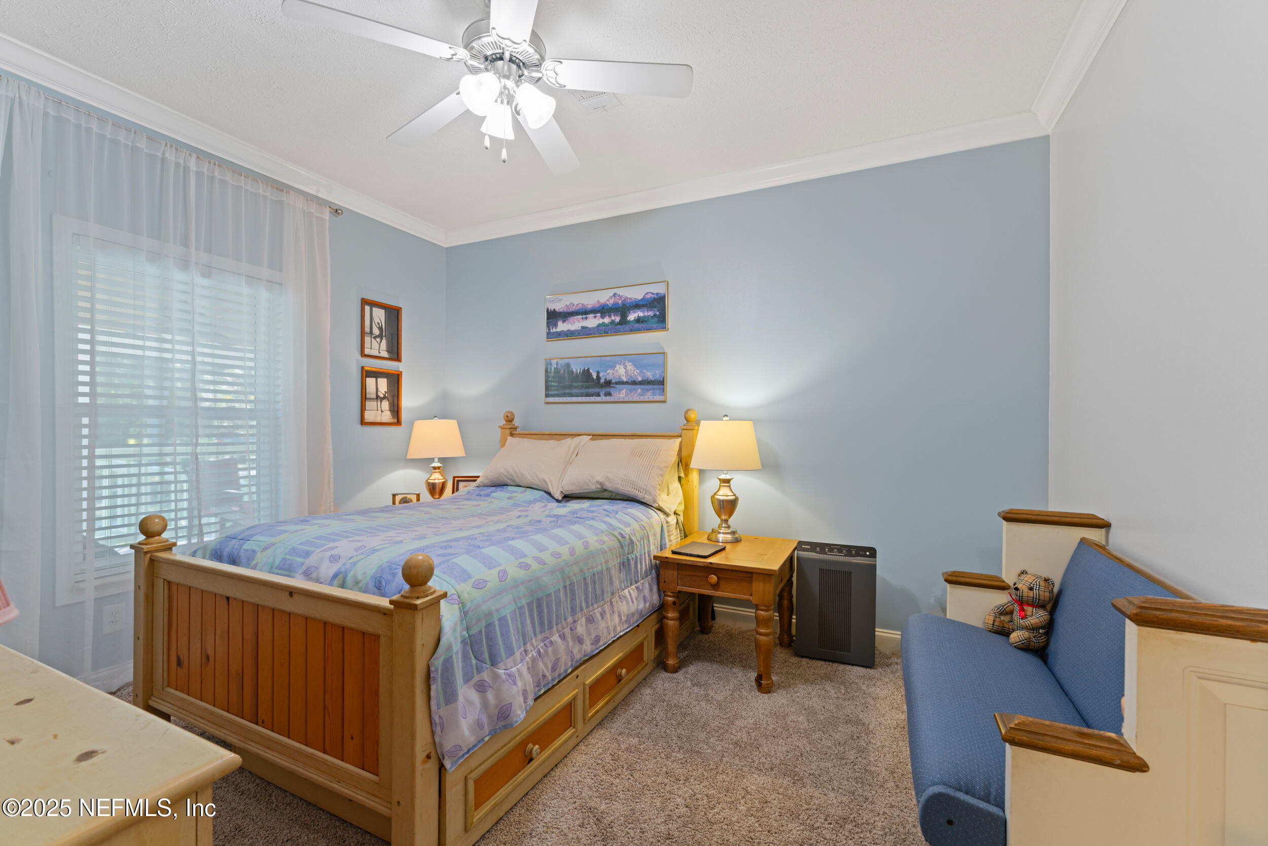 1463 Bardin Road Palatka, FL 32177 - Photo 36 of 61 a bedroom with a bed and a chandelier