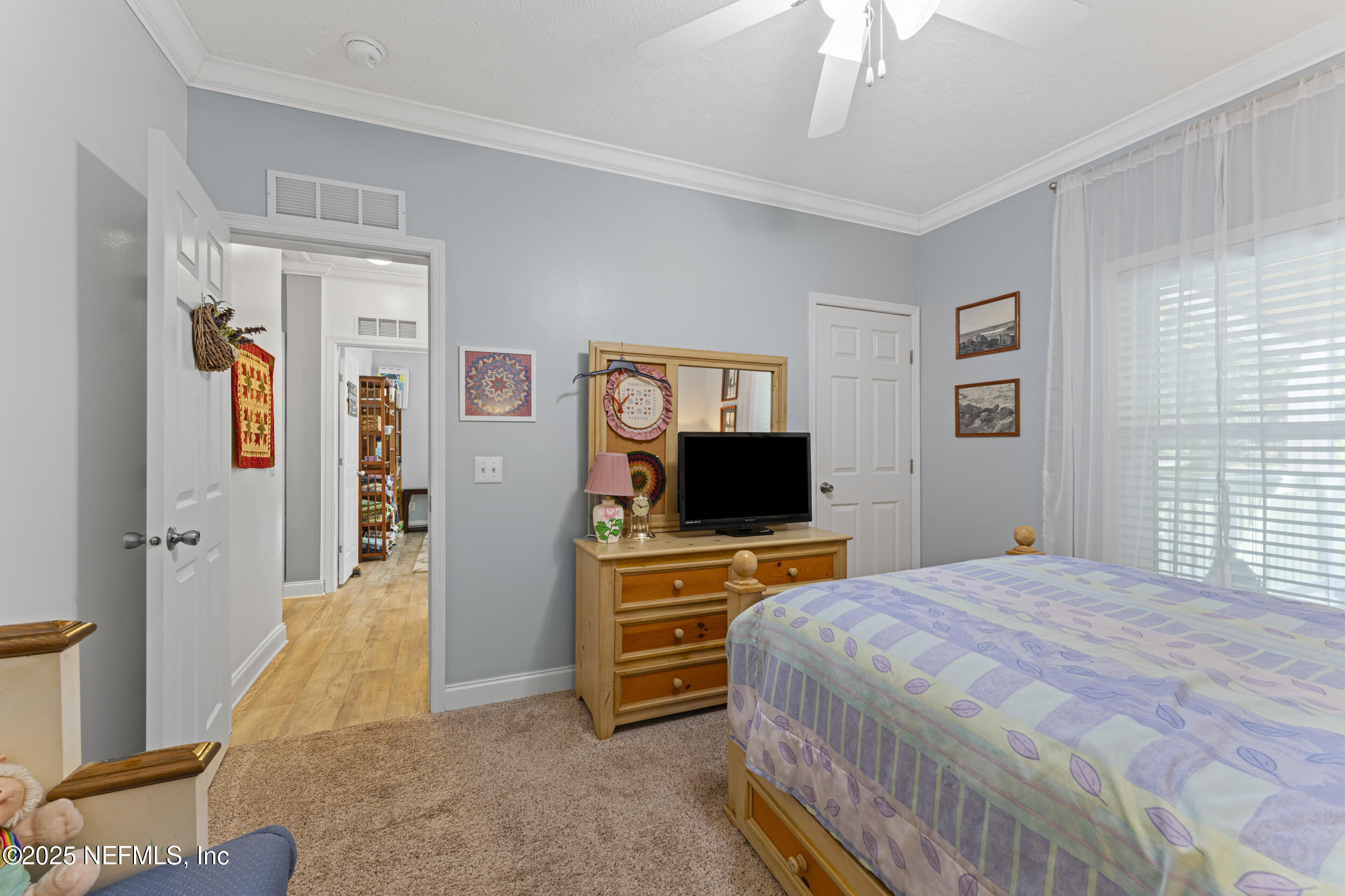 1463 Bardin Road Palatka, FL 32177 - Photo 37 of 61 a bedroom with a bed and a flat screen tv