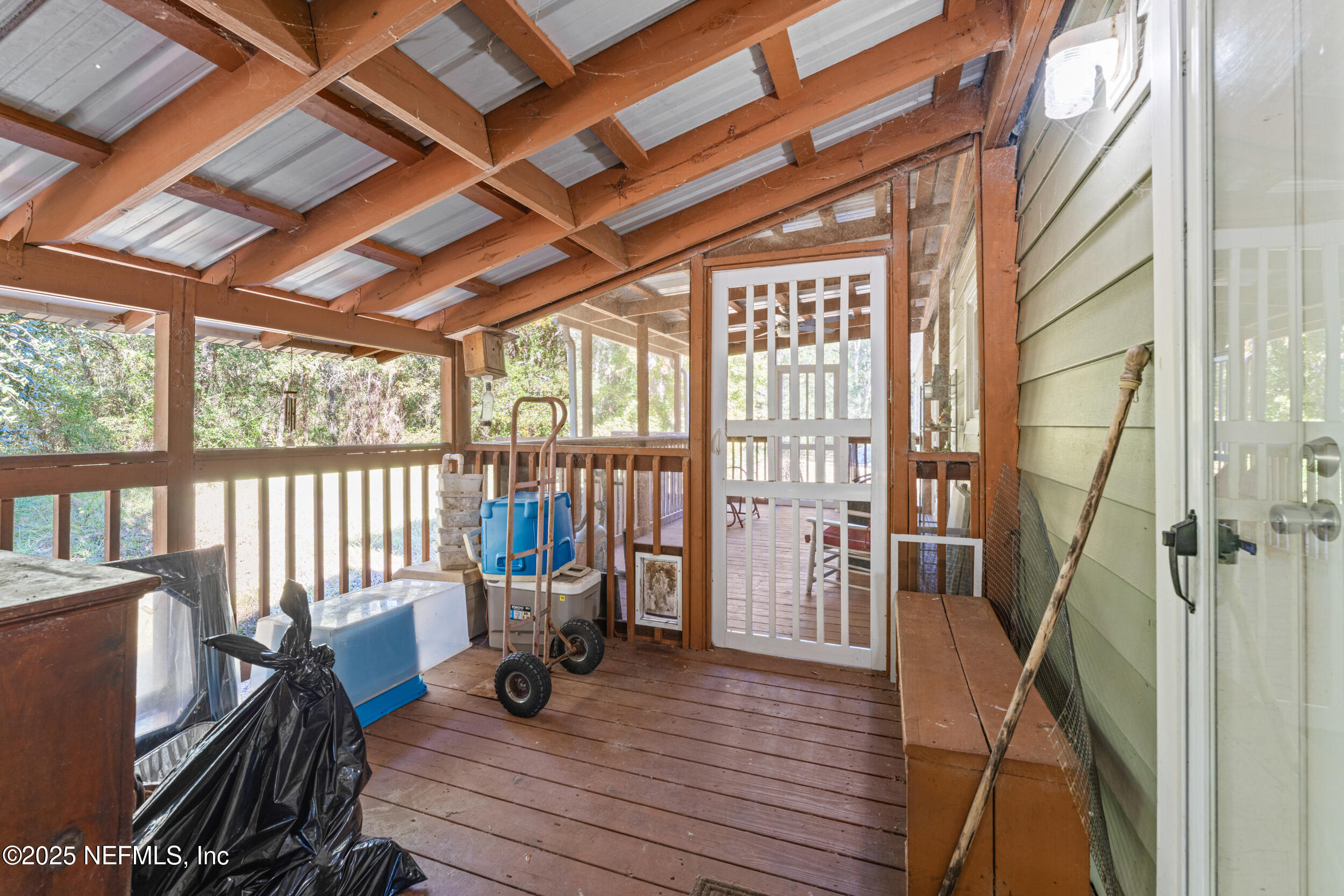 1463 Bardin Road Palatka, FL 32177 - Photo 41 of 61 a living room with furniture and a floor to ceiling window
