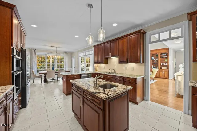 a view of a dining room with furniture large windows and wooden floor