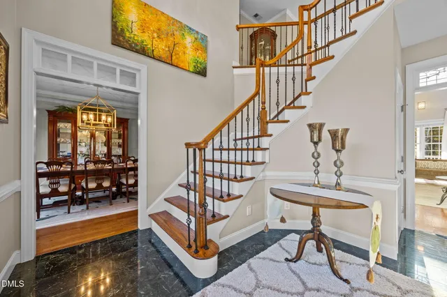 a view of entryway dining room and hall with wooden floor
