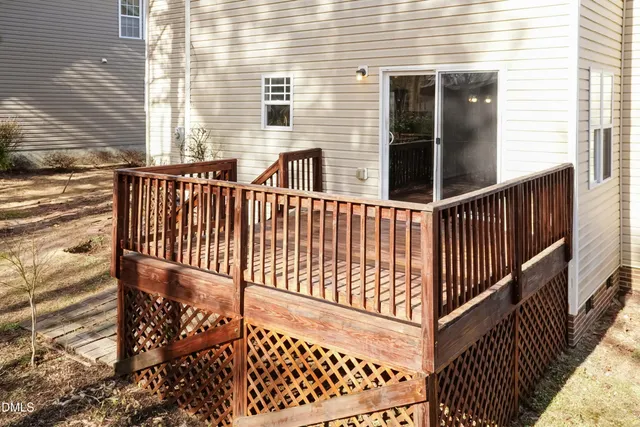 a front view of a house with a yard and tree s