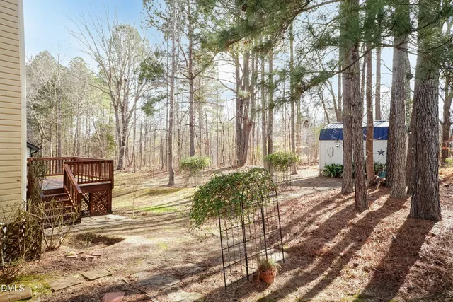 a view of a backyard with swimming pool