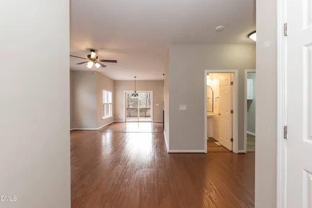 a view of livingroom with hardwood floor and kitchen view