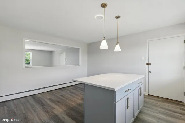 a kitchen that has a lot of cabinets in it