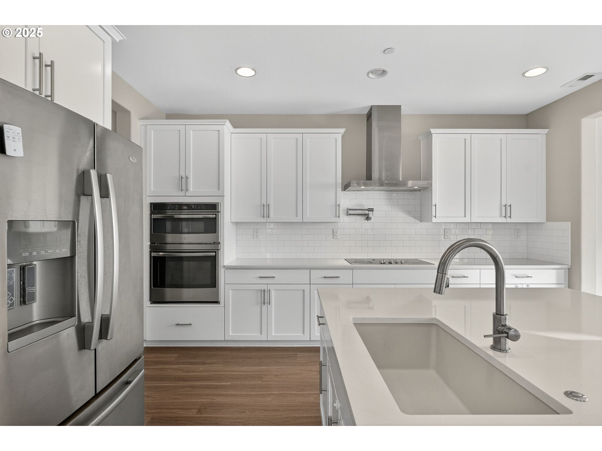 9863 Southwest Ridge Drive Beaverton, OR 97007 - Photo 16 of 48 a kitchen with kitchen island a sink stainless steel appliances and cabinets