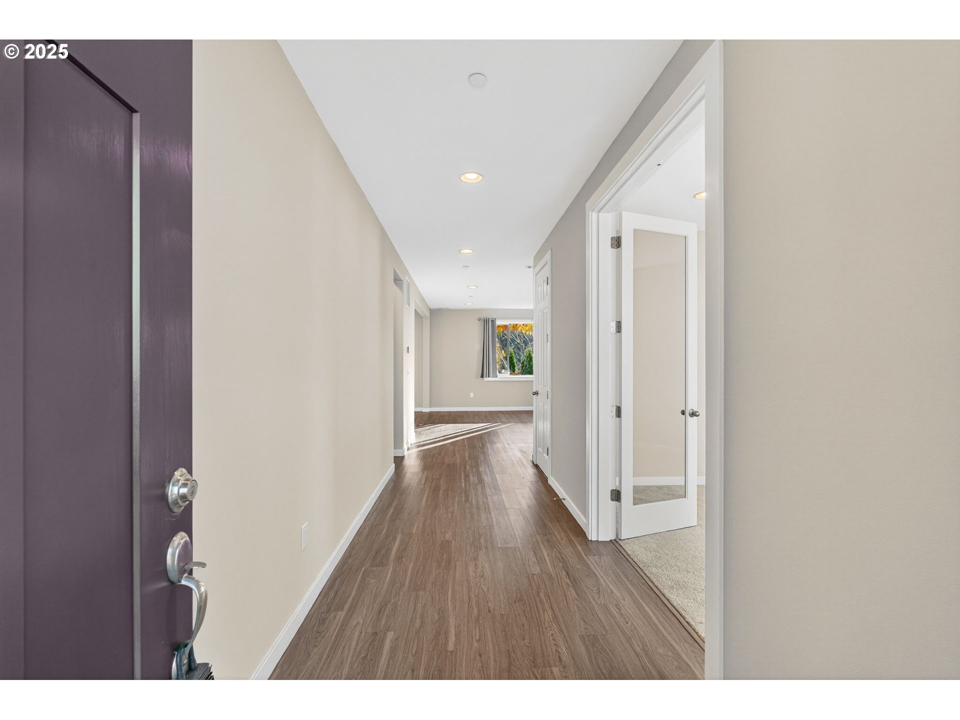 9863 Southwest Ridge Drive Beaverton, OR 97007 - Photo 2 of 48 a view of an empty room with wooden floor