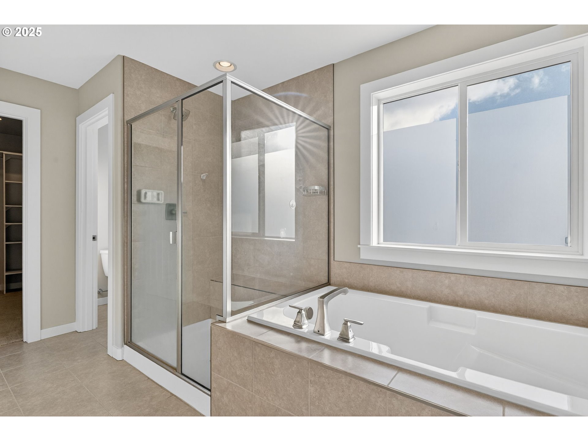 9863 Southwest Ridge Drive Beaverton, OR 97007 - Photo 27 of 48 a bathroom with a tub and a shower