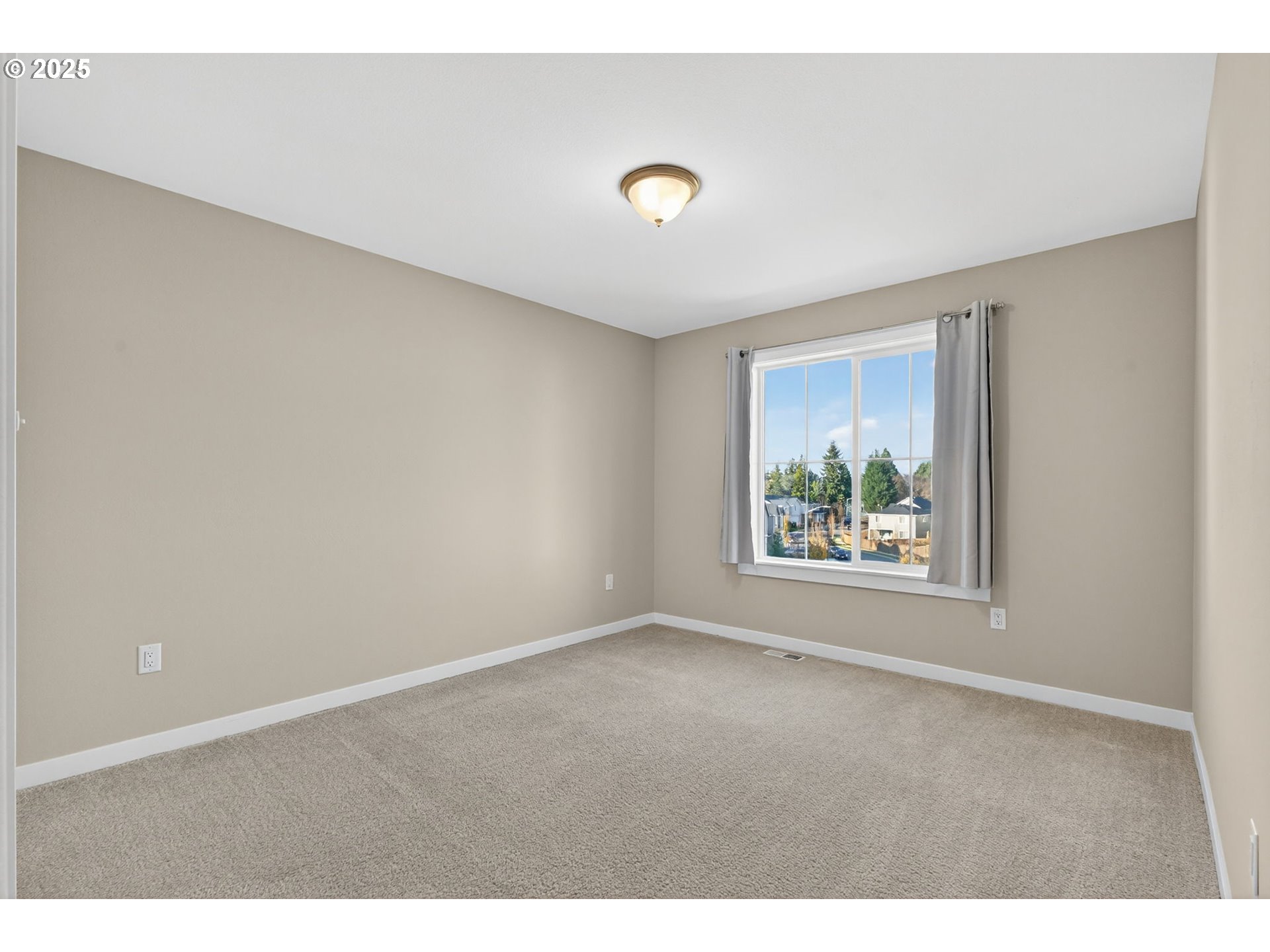 9863 Southwest Ridge Drive Beaverton, OR 97007 - Photo 29 of 48 a view of an empty room with a window