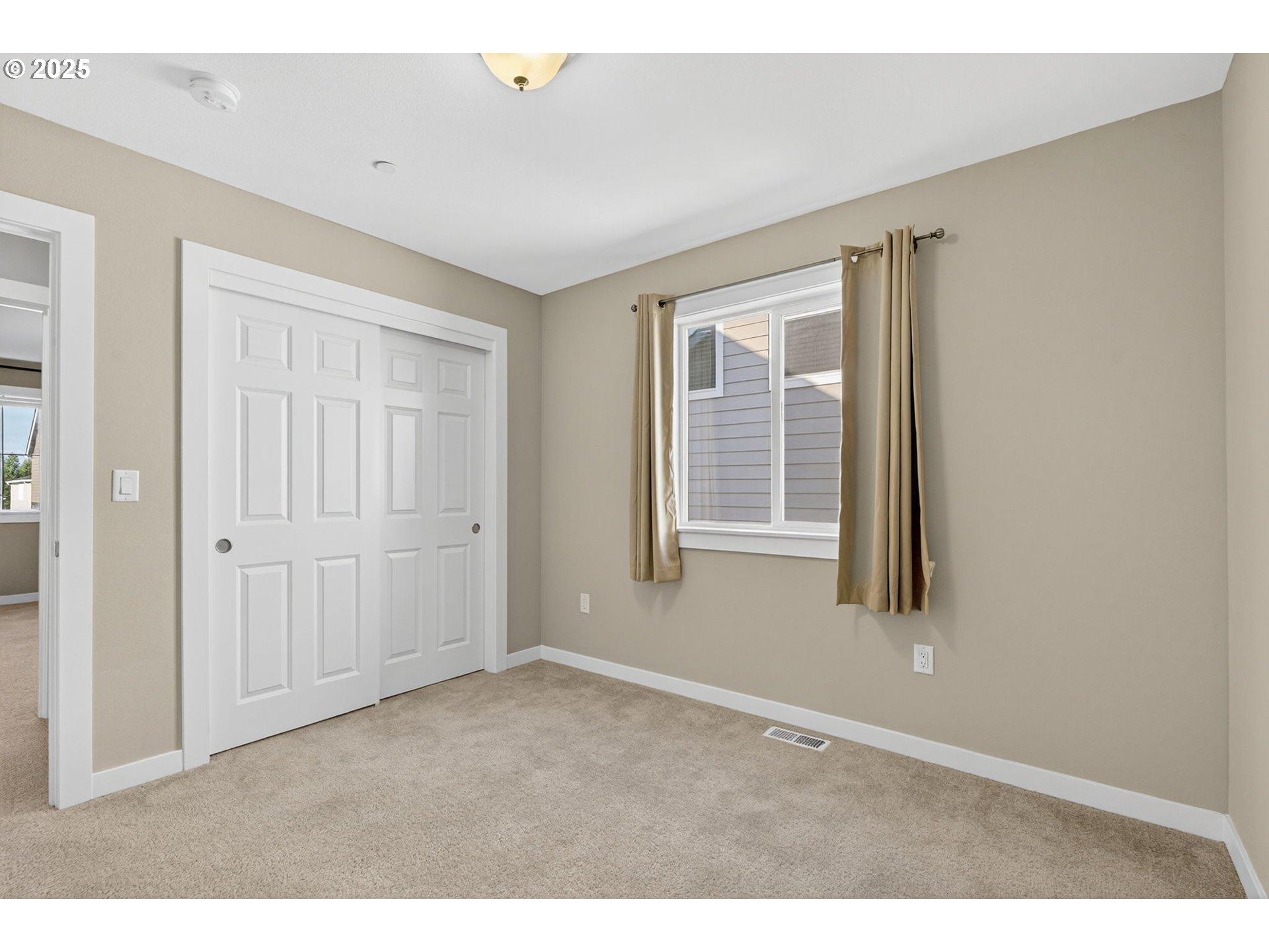 9863 Southwest Ridge Drive Beaverton, OR 97007 - Photo 31 of 48 a view of an empty room with a window