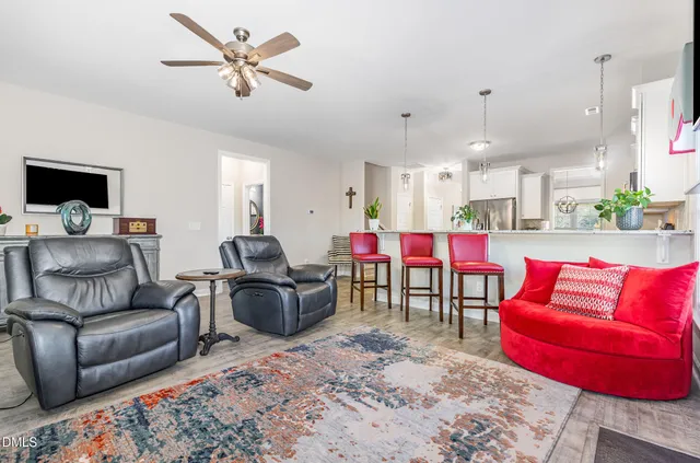 a room with furniture and a potted plant