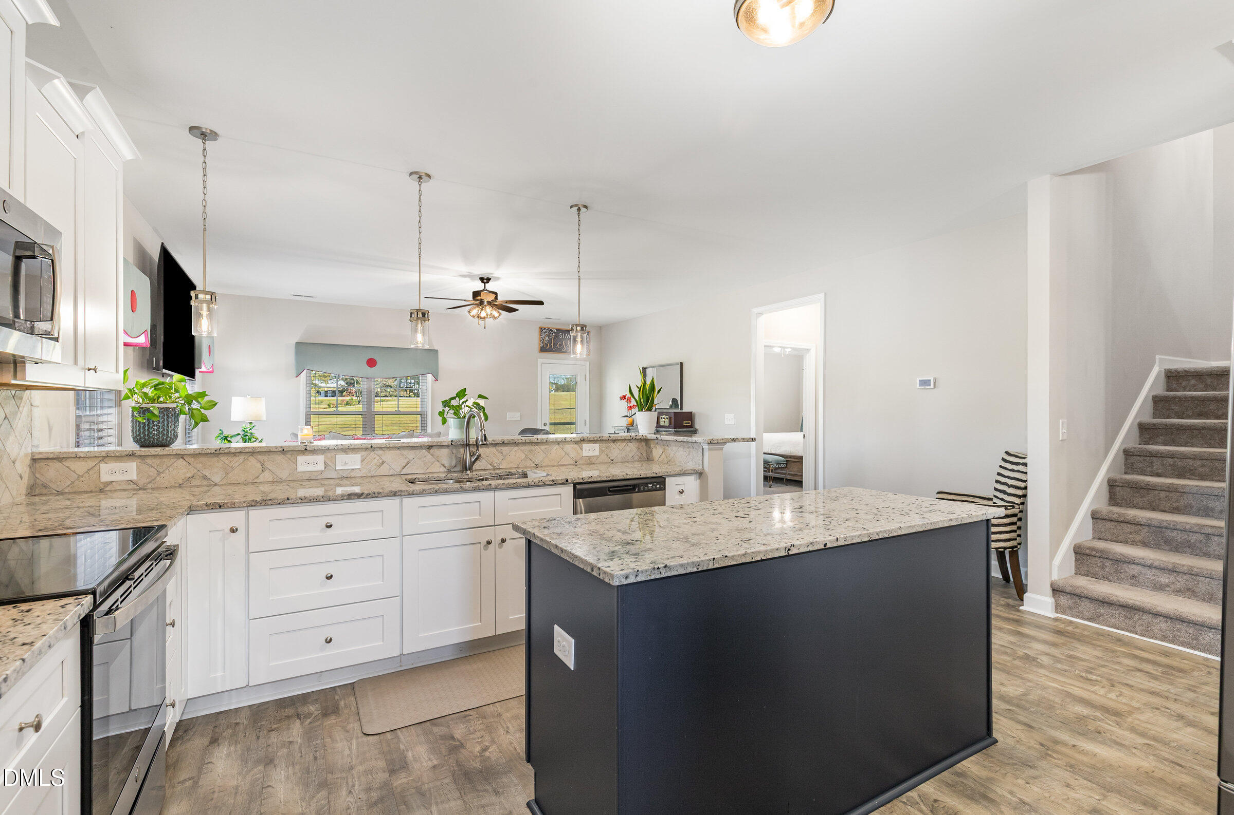 8662 Buckhorn Plantation Road Sims, NC 27880 - Photo 13 of 40 a kitchen with sink and cabinets