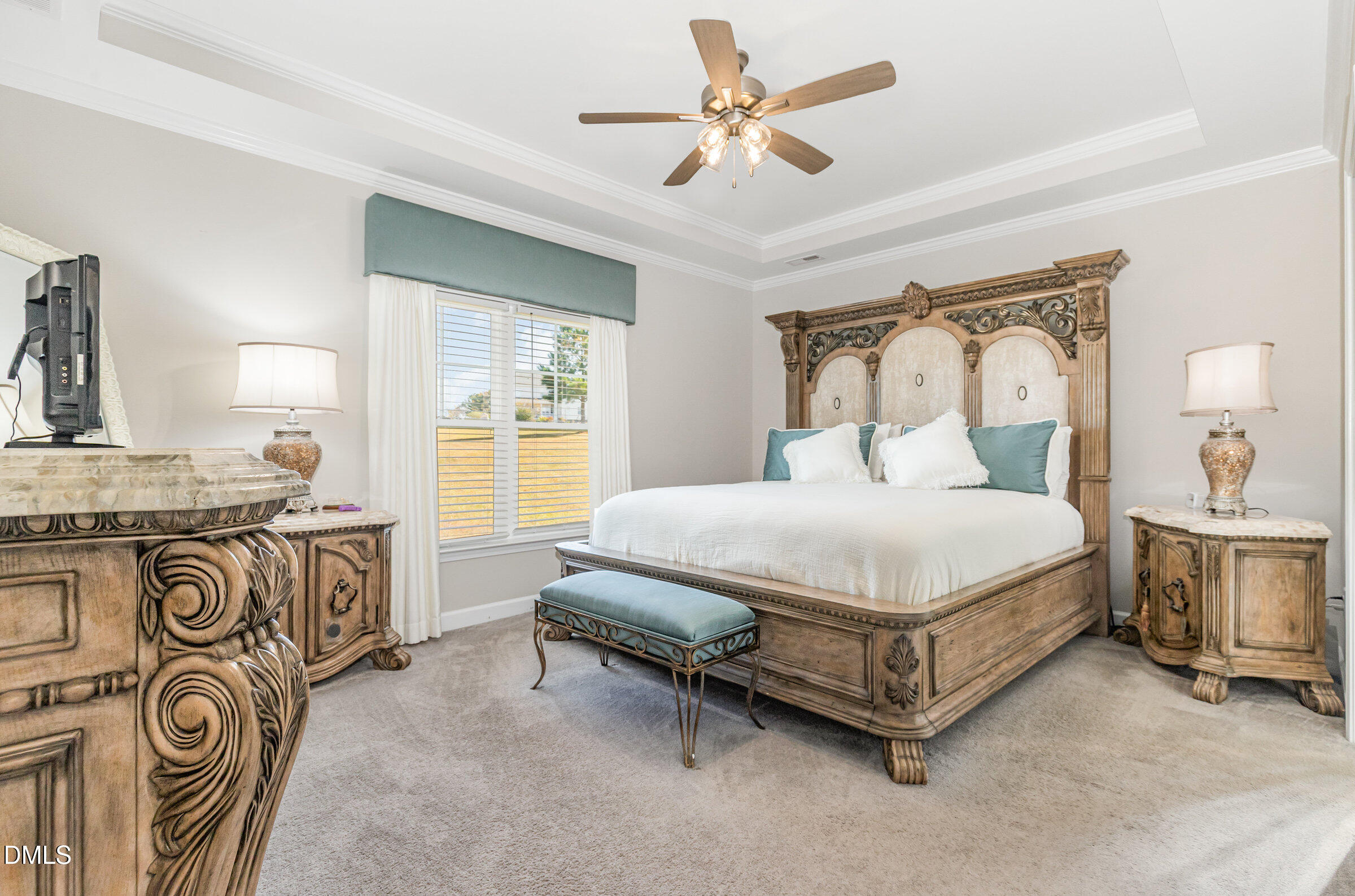 8662 Buckhorn Plantation Road Sims, NC 27880 - Photo 17 of 40 a spacious bedroom with a bed a dresser and windows
