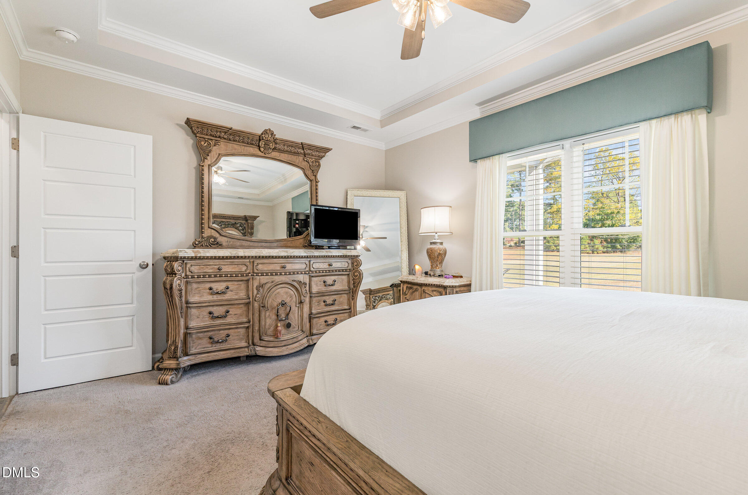 8662 Buckhorn Plantation Road Sims, NC 27880 - Photo 20 of 40 a spacious bedroom with a bed and a cabinets