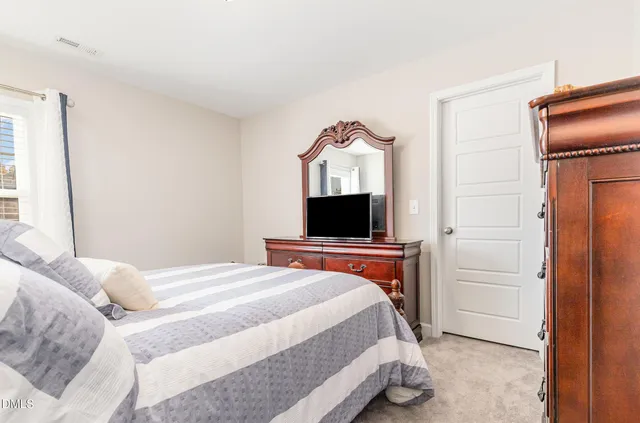 a bathroom with double sink and a mirror