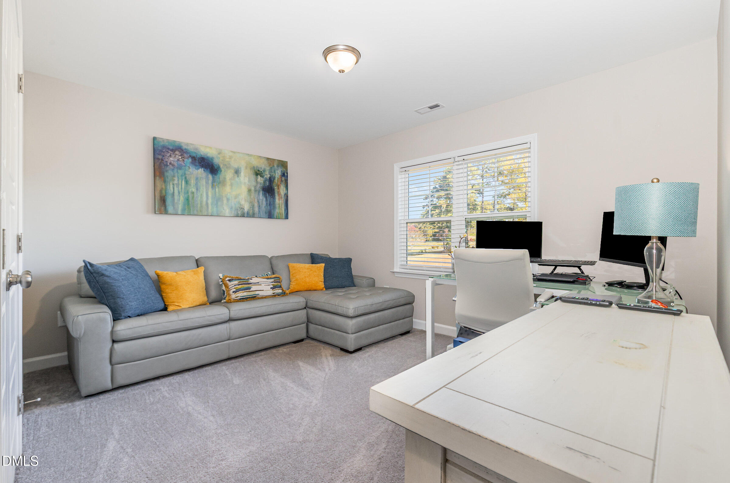 8662 Buckhorn Plantation Road Sims, NC 27880 - Photo 27 of 40 a living room with furniture and a flat screen tv