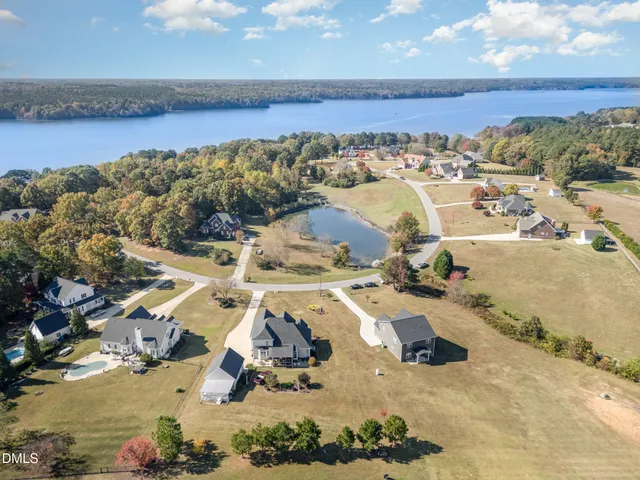 an aerial view of multiple house with yard