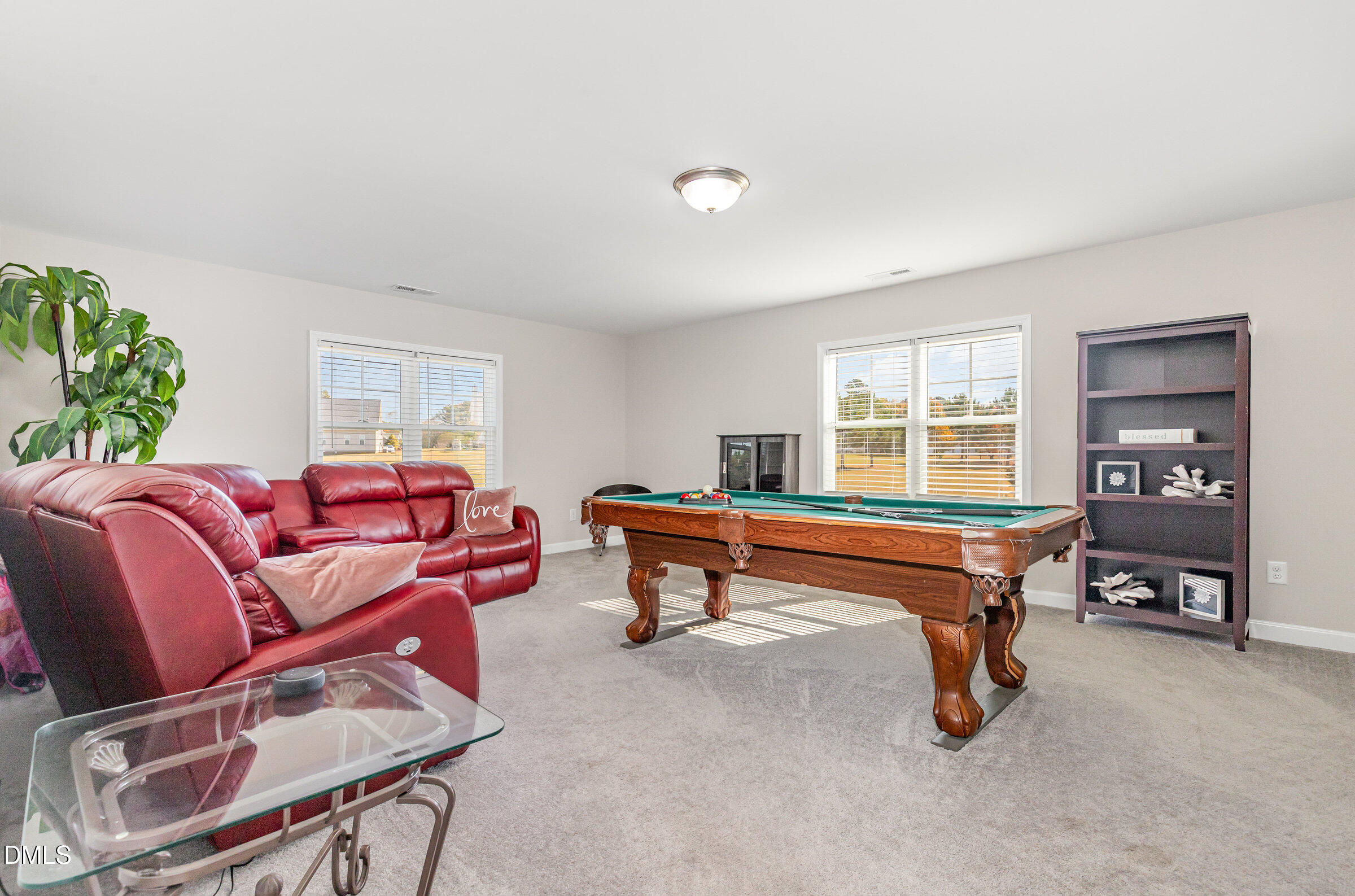 8662 Buckhorn Plantation Road Sims, NC 27880 - Photo 29 of 40 a living room with furniture a window and a flat screen tv