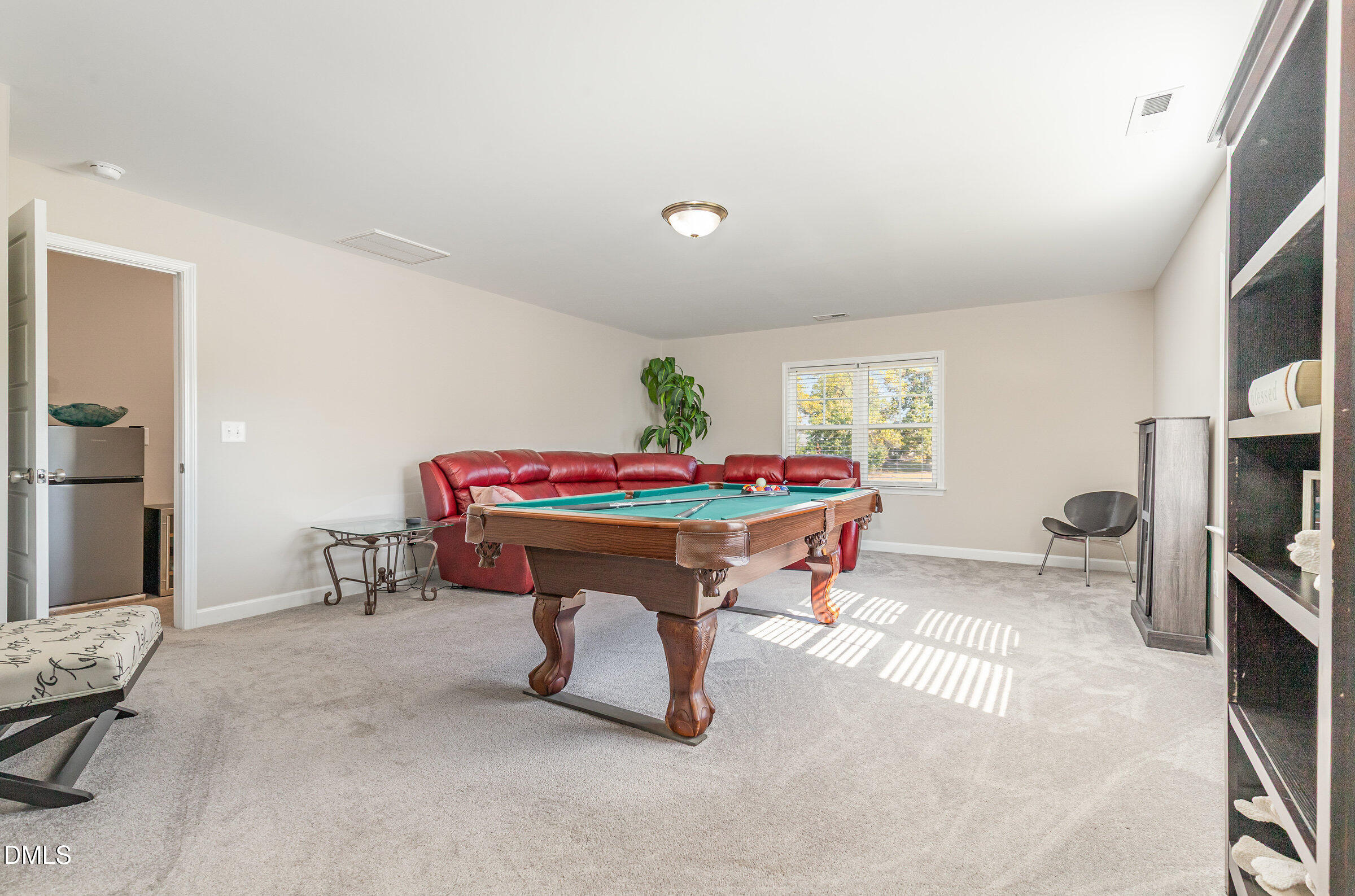 8662 Buckhorn Plantation Road Sims, NC 27880 - Photo 30 of 40 a living room with furniture and a flat screen tv