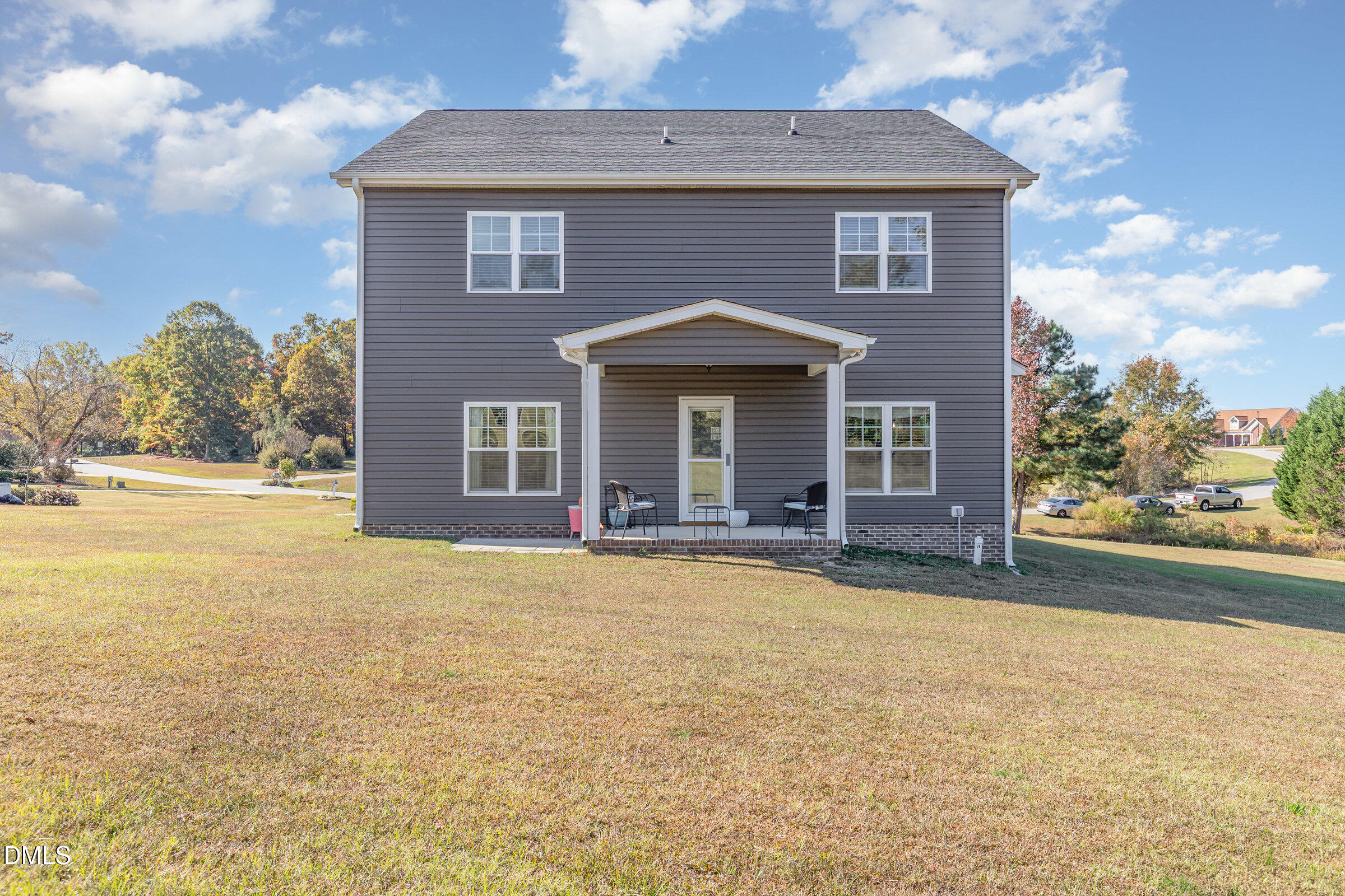 8662 Buckhorn Plantation Road Sims, NC 27880 - Photo 33 of 40 a front view of a house with a yard and garage