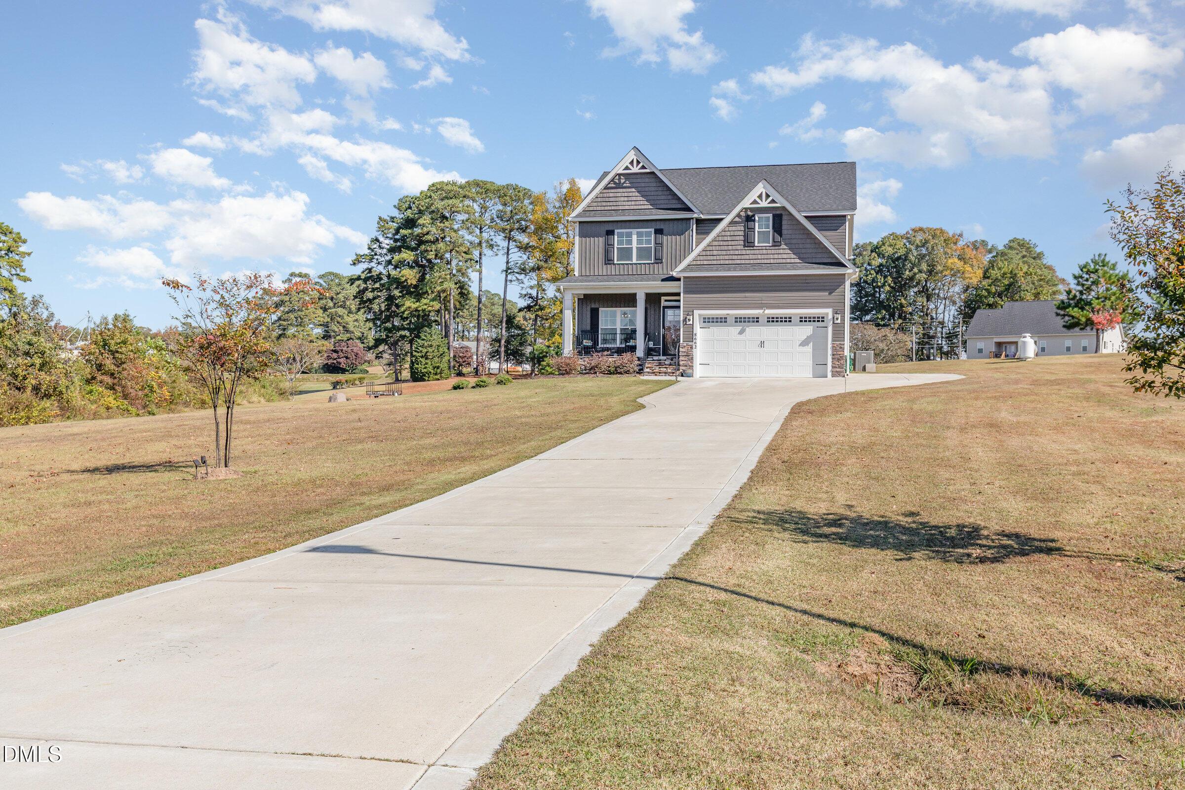 8662 Buckhorn Plantation Road Sims, NC 27880 - Photo 36 of 40 a front view of a house with a yard and garage