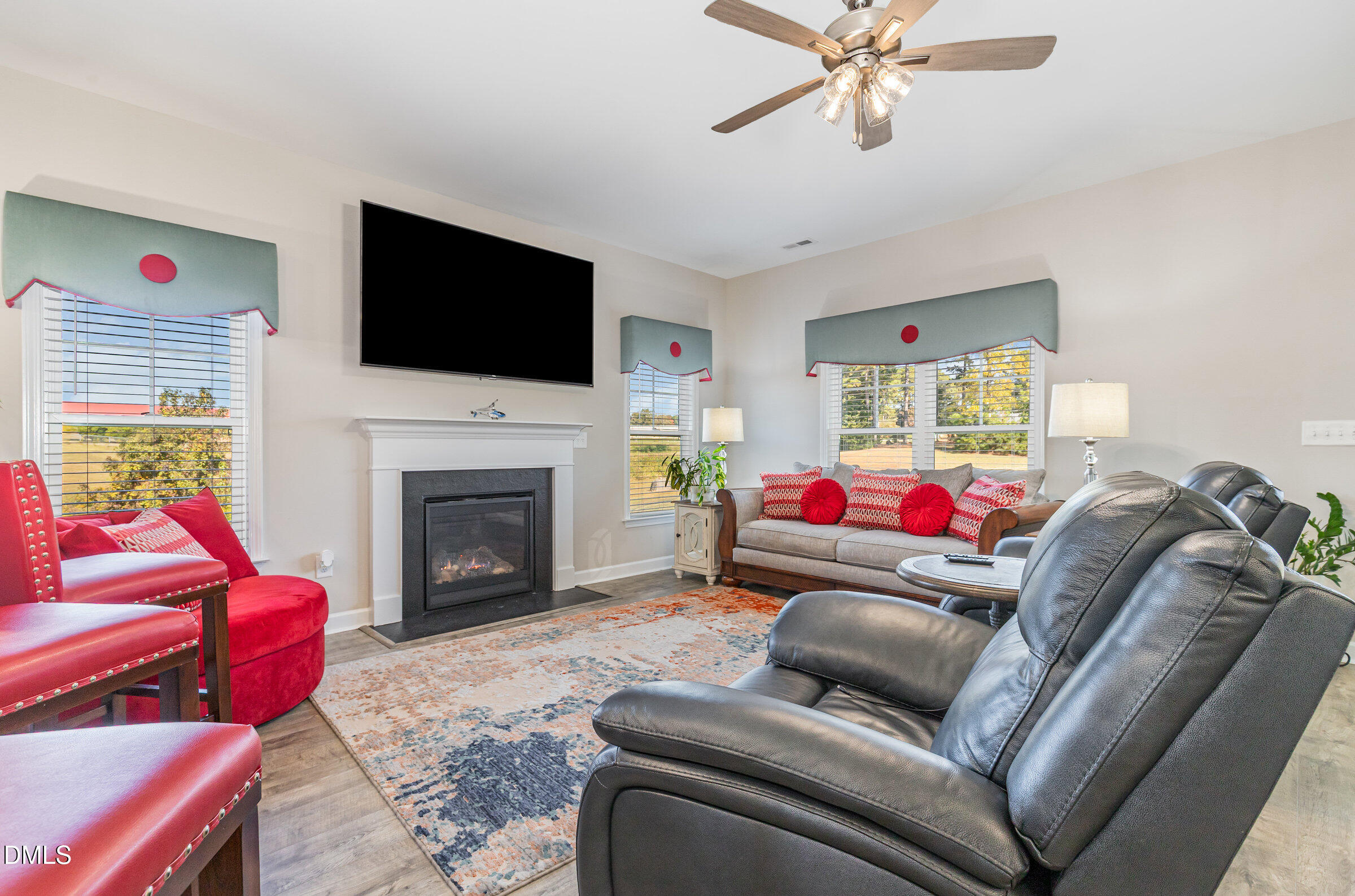 8662 Buckhorn Plantation Road Sims, NC 27880 - Photo 4 of 40 a living room with furniture and a fireplace