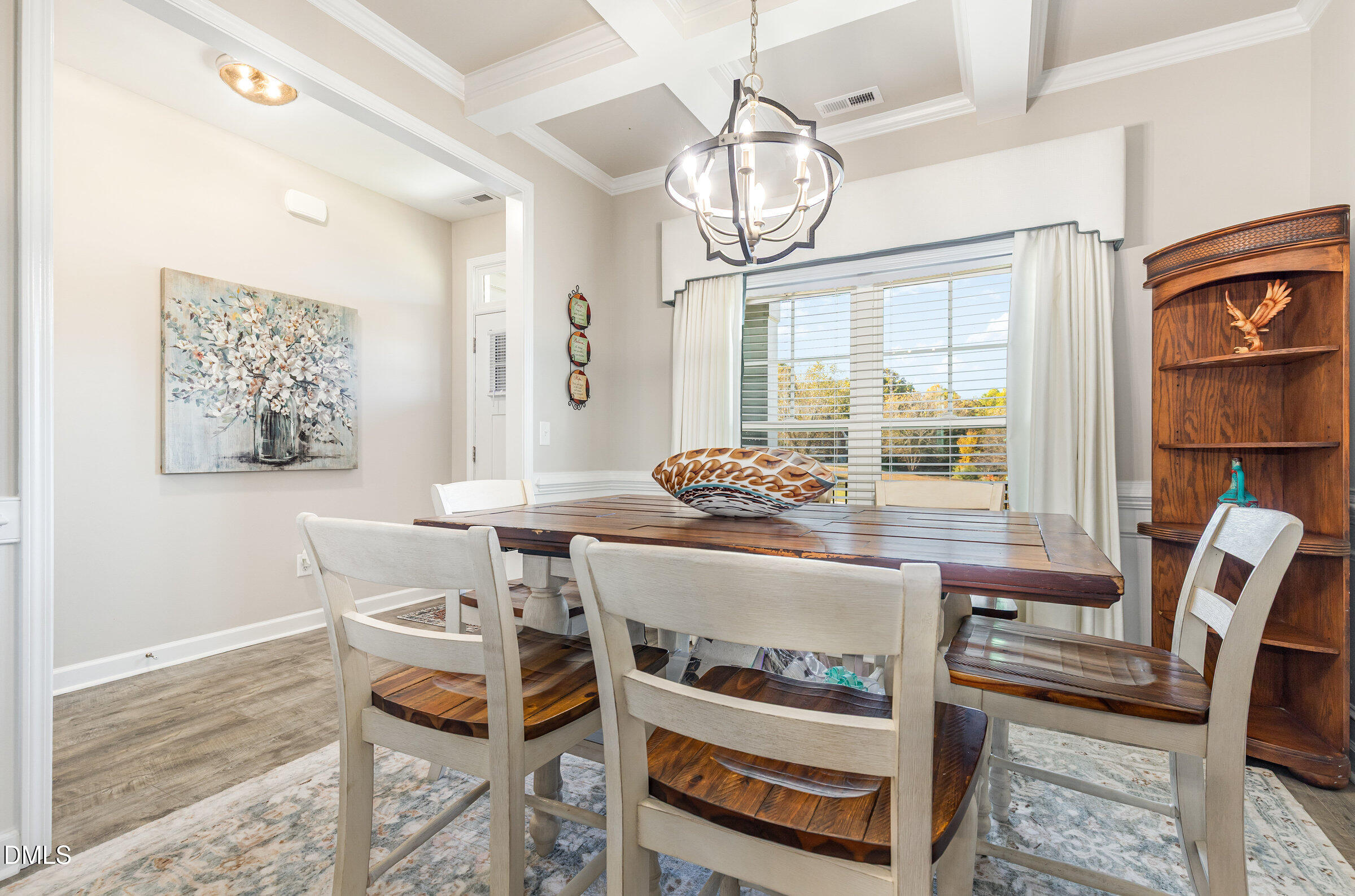 8662 Buckhorn Plantation Road Sims, NC 27880 - Photo 5 of 40 a view of a dining room with furniture a chandelier and wooden floor
