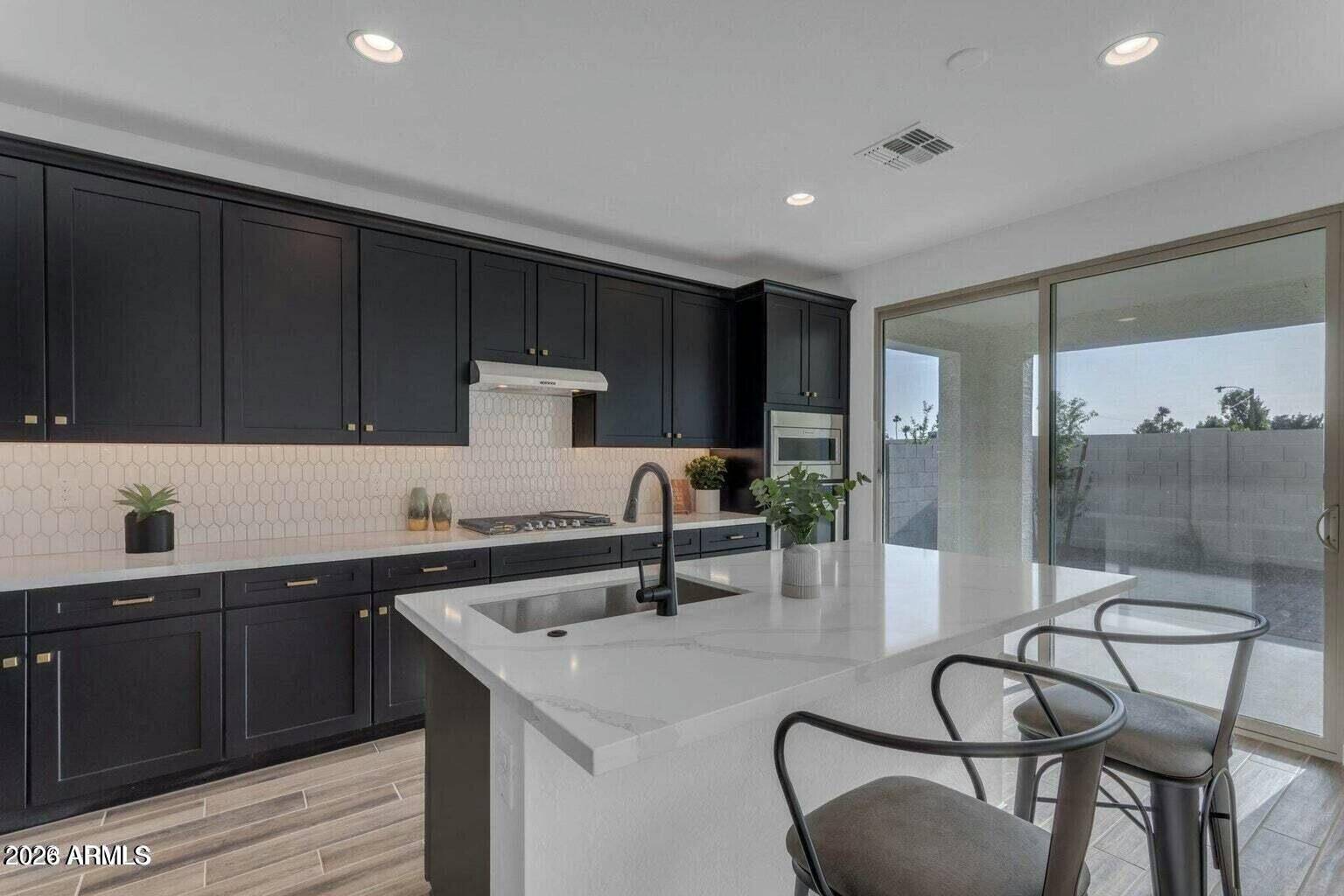 6434 North 17th Street Phoenix, AZ 85016 - Photo 12 of 38 a kitchen with a sink cabinets and window