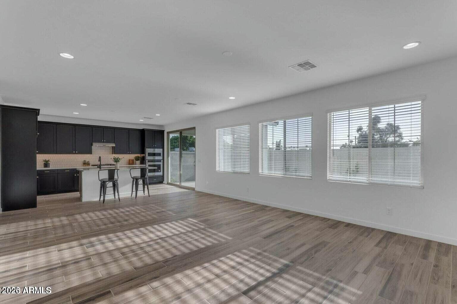 6434 North 17th Street Phoenix, AZ 85016 - Photo 18 of 38 a view of a livingroom with furniture wooden floor and window