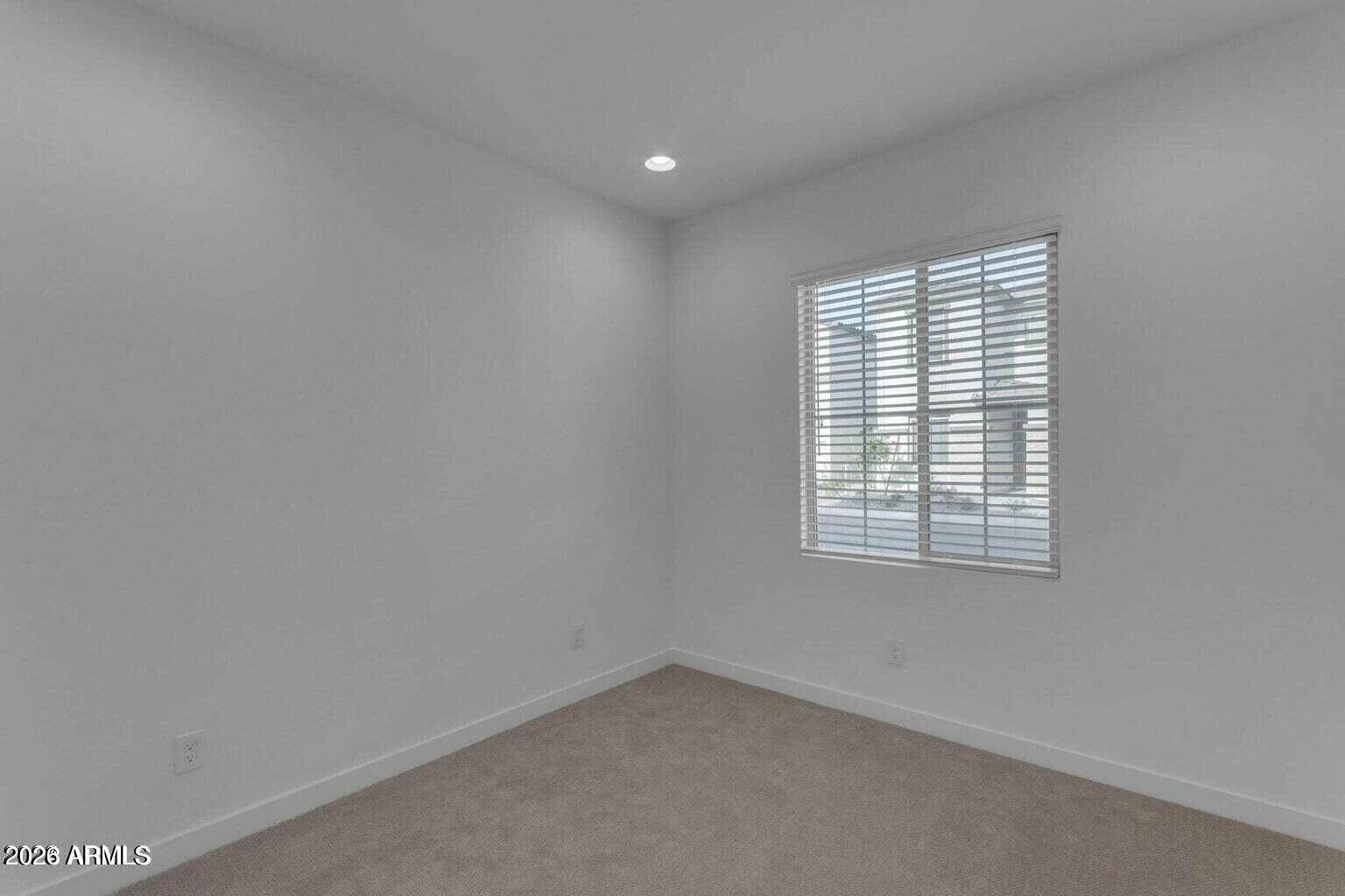 6434 North 17th Street Phoenix, AZ 85016 - Photo 9 of 38 an empty room with a window