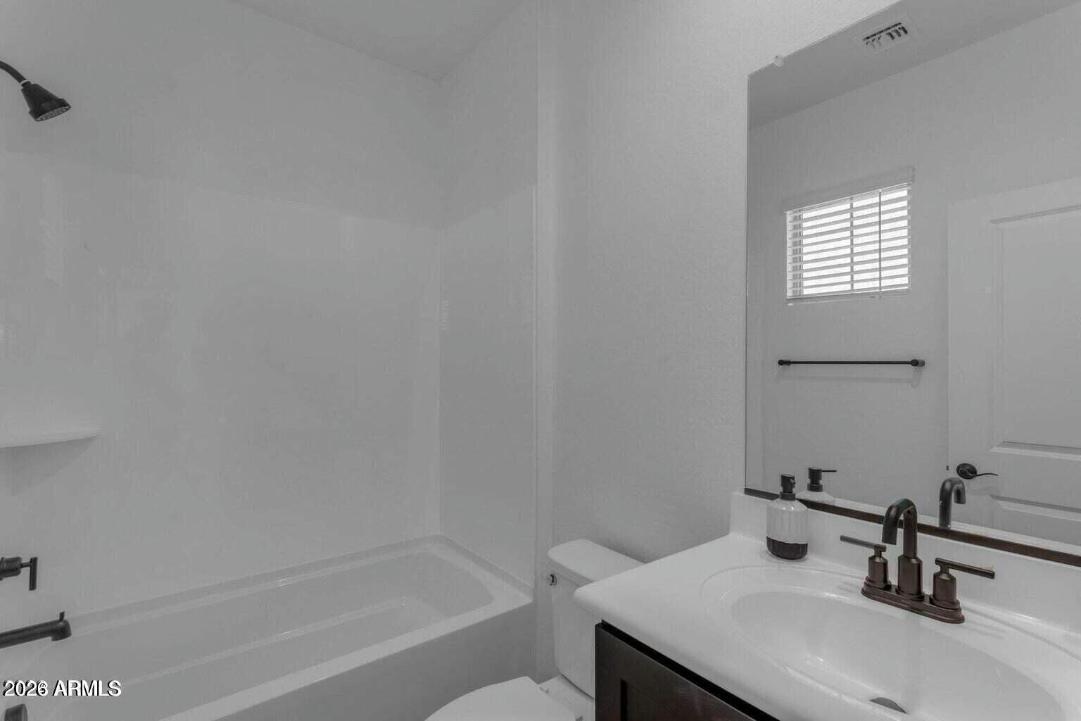 6434 North 17th Street Phoenix, AZ 85016 - Photo 10 of 38 a bathroom with a sink and a bathtub