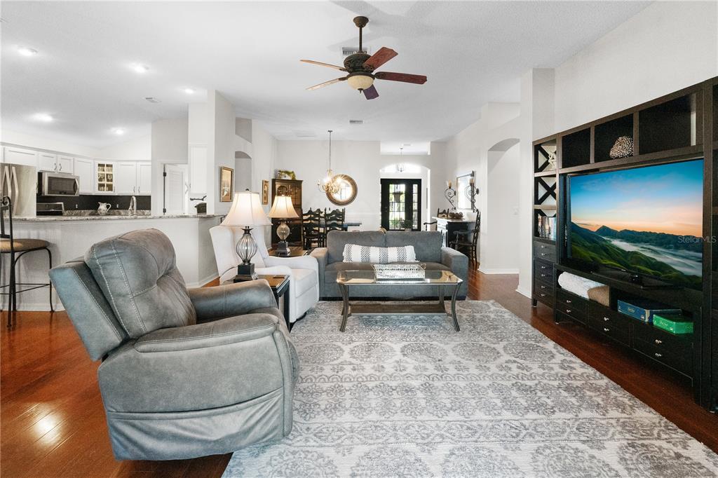 1456 Honea Path The Villages, FL 32162 - Photo 24 of 44 a living room with furniture and a flat screen tv