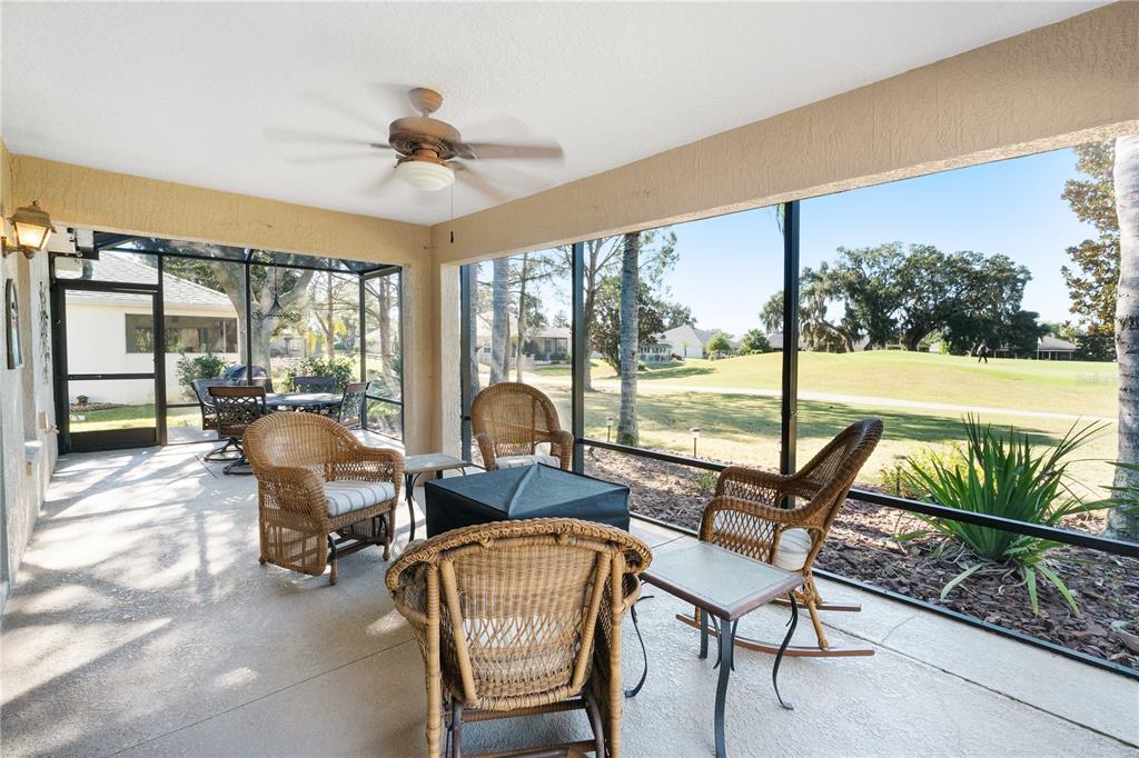 1456 Honea Path The Villages, FL 32162 - Photo 25 of 44 a living room with furniture and a floor to ceiling window
