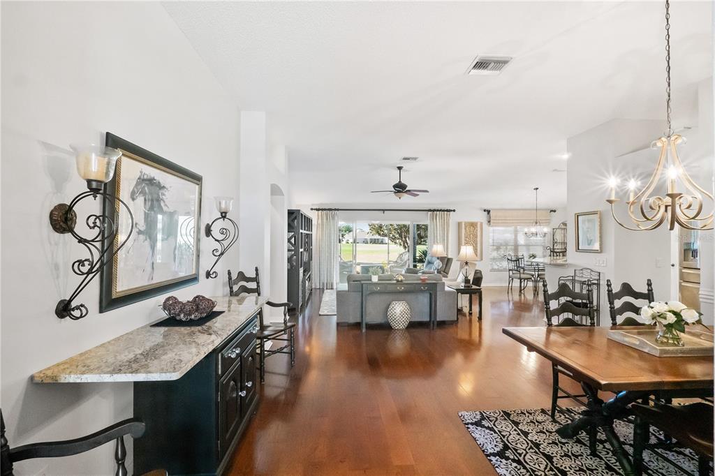 1456 Honea Path The Villages, FL 32162 - Photo 6 of 44 a view of a dining room with furniture window and wooden floor