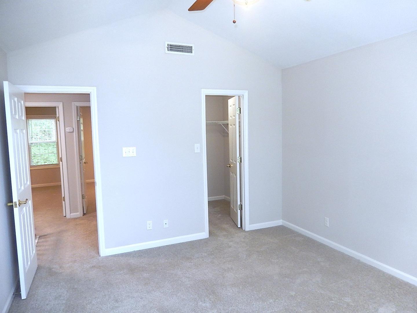 211 Bridgepath Drive Cary, NC 27513 - Photo 17 of 26 an empty room with closet and mirrors